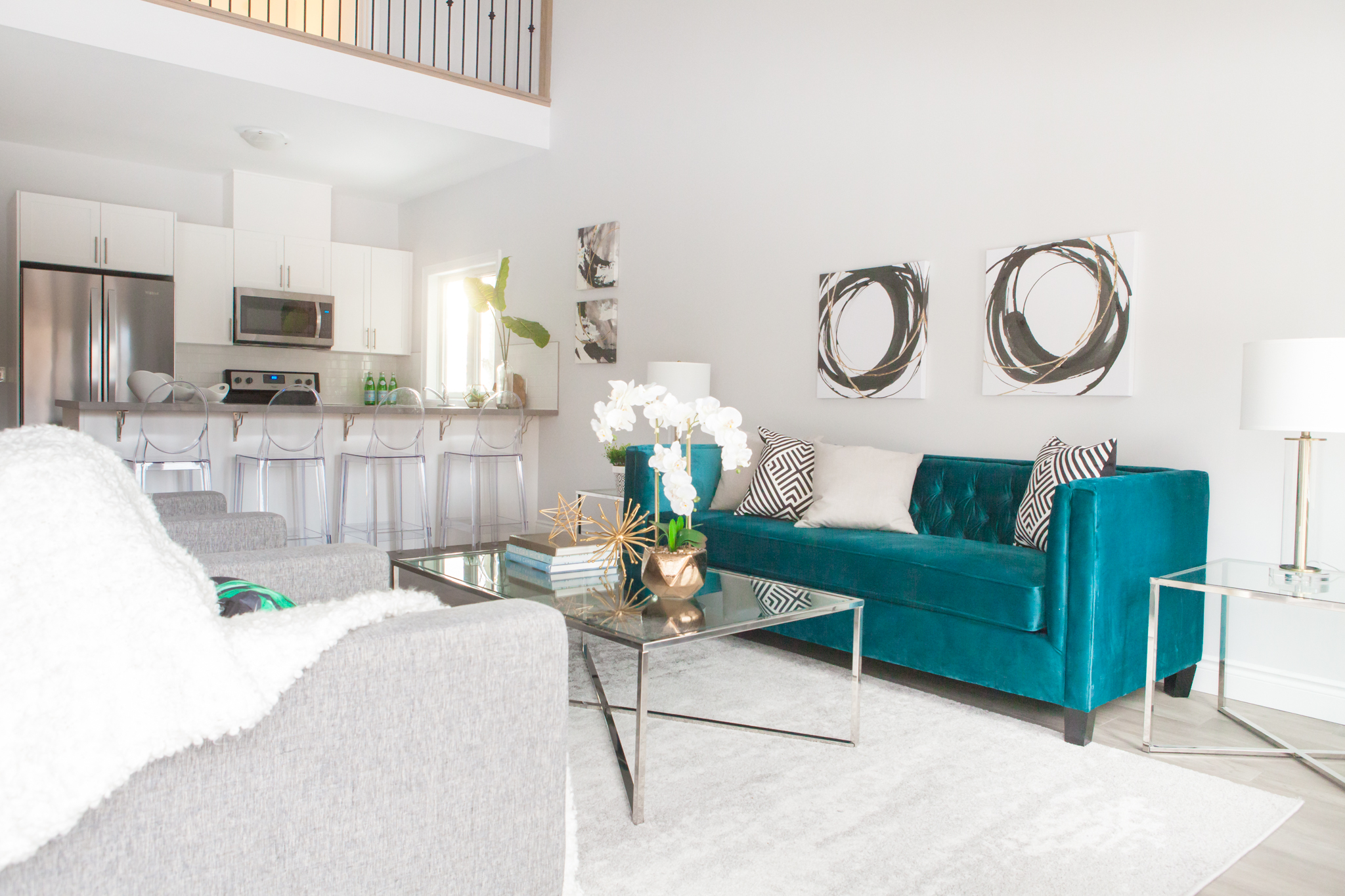 Home Staging project in Barrie. This emerald green sofa looks amazing in the space.