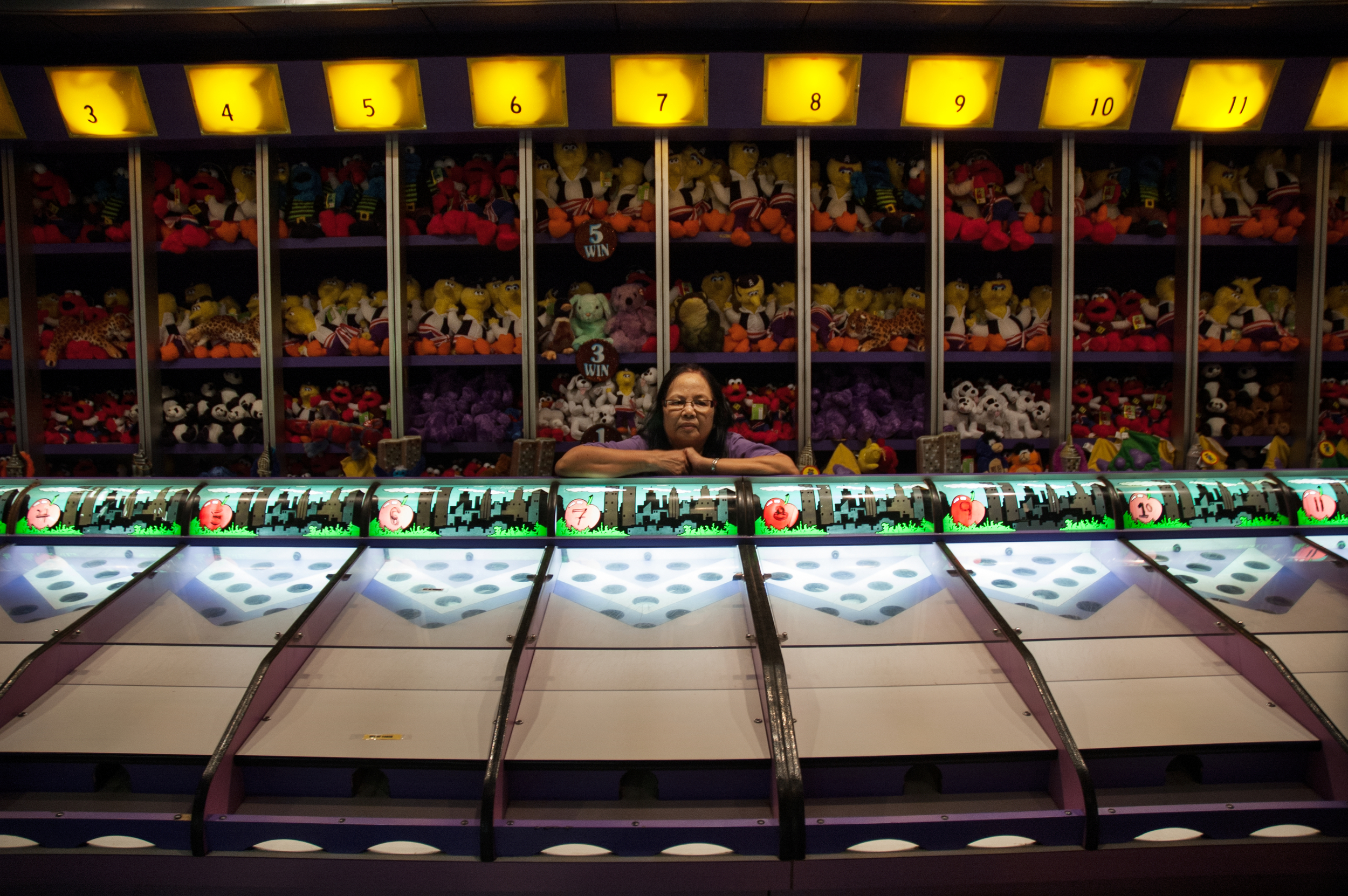 An employee waits for the next player at an arcade game in the New York New York Hotel and Casino, Las Vegas, NV. 