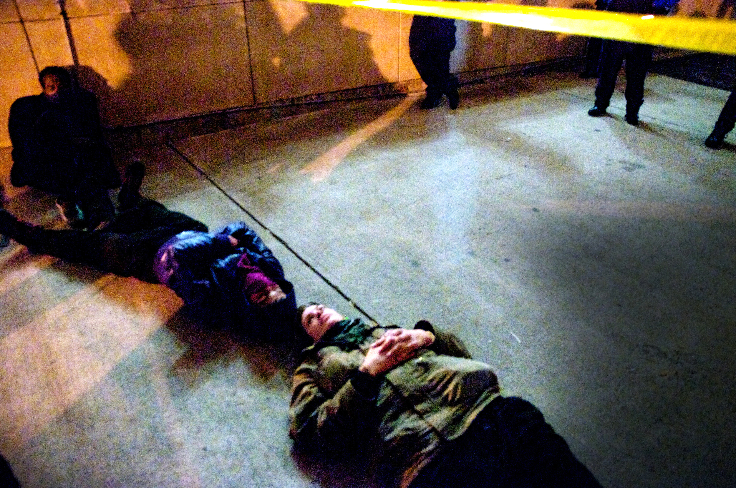 Occupy D.C. activists block alleyway leading to Franklin School while fellow protesters occupy the abandoned building in hopes of converting it to a space for the local homeless population. 