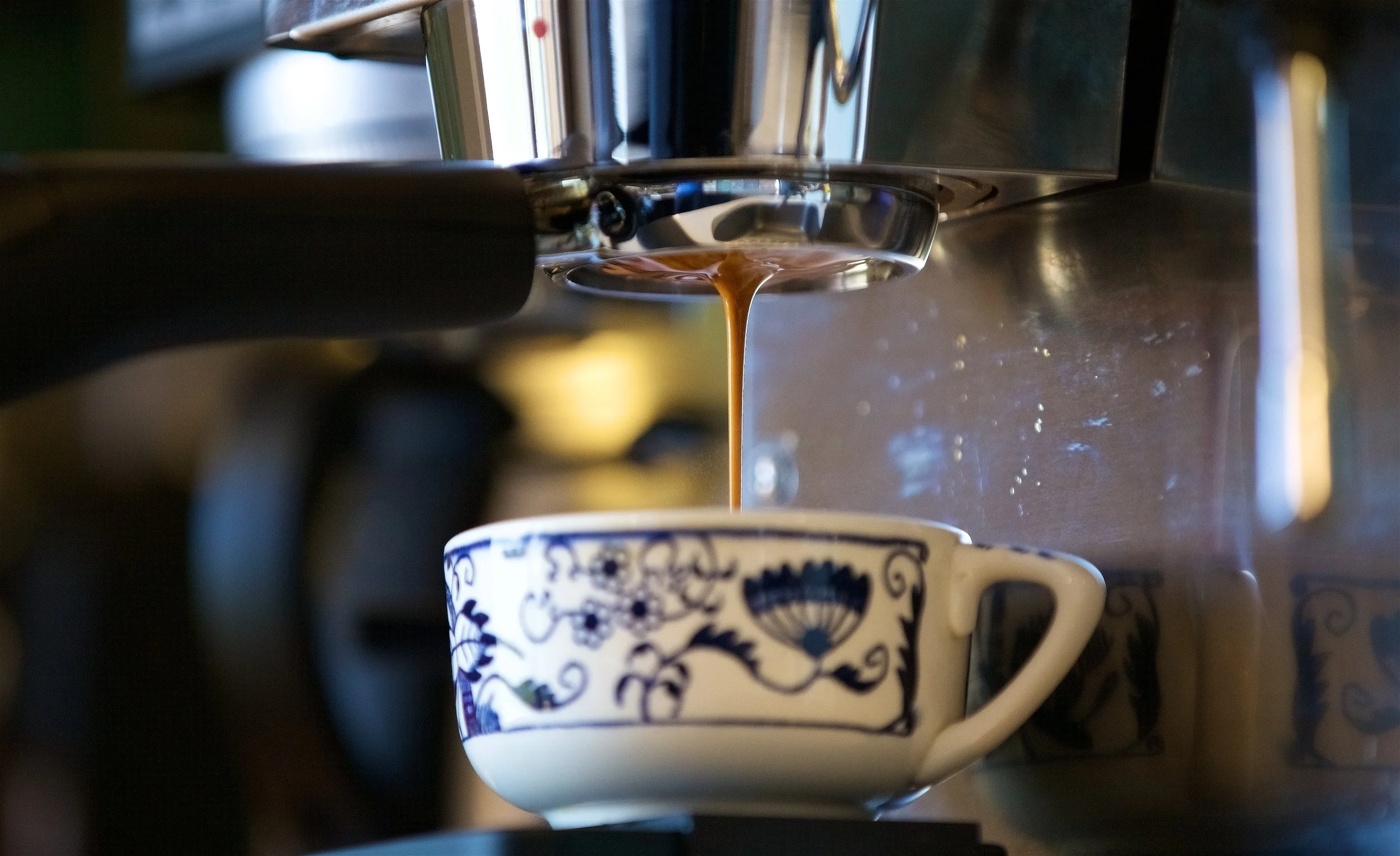 Near the end of a pour the espresso consolidates into a single thick stream of a brown color.