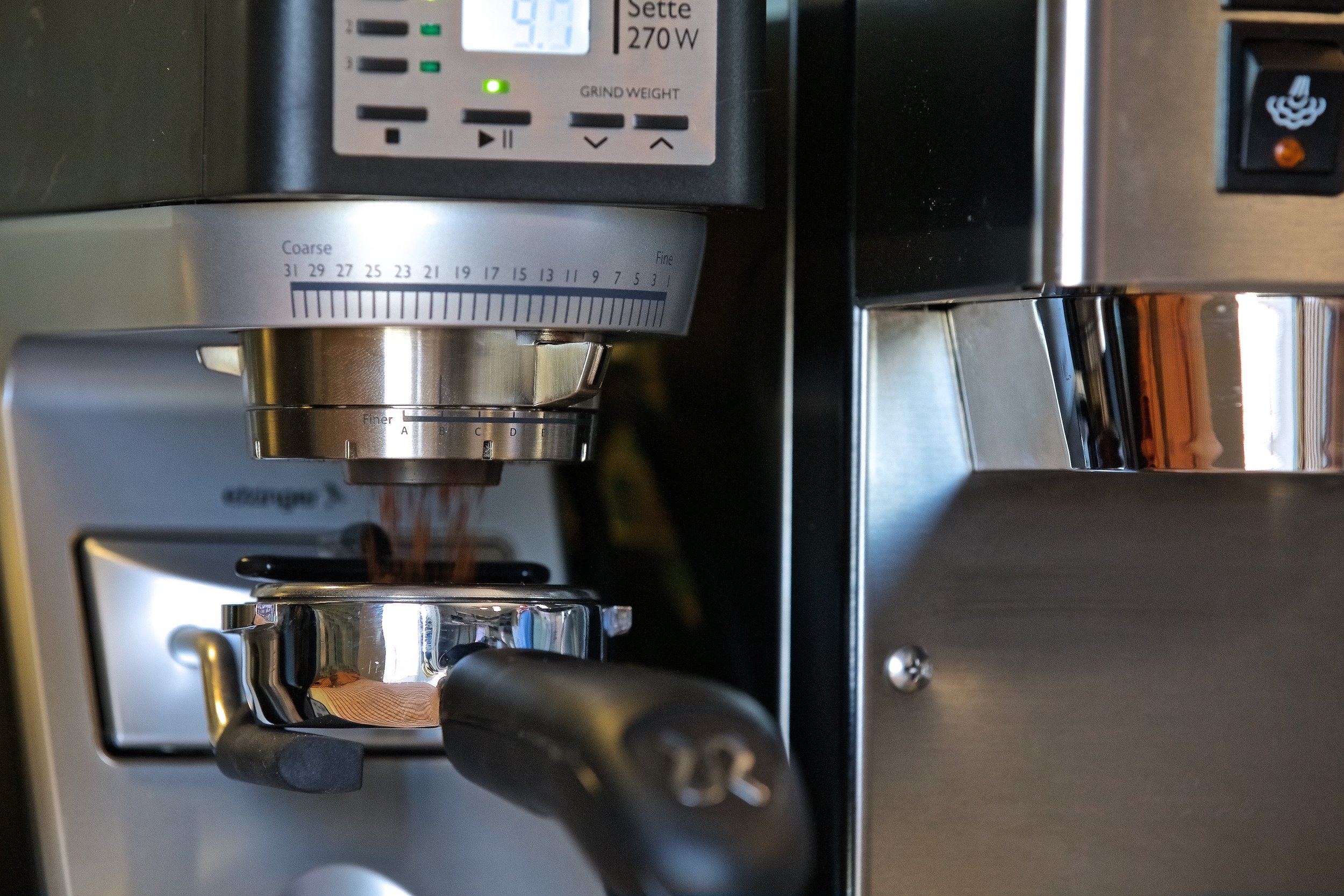 The Baratza Sette 270W grinding into a bottomless portafilter. The coffee grounds shoot out of the grinder almost like a jet engine, at a remarkable level of consistency.