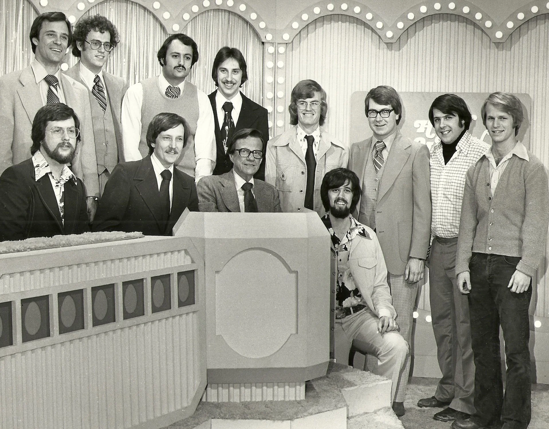 TV game show host Bill Cullen and the QUBE technical crew for the first interactive game show “How Do You Like Your Eggs?”—which was broadcast to 200 homes in Upper Arlington during the summer of 1977. Jim is seated on the far left.