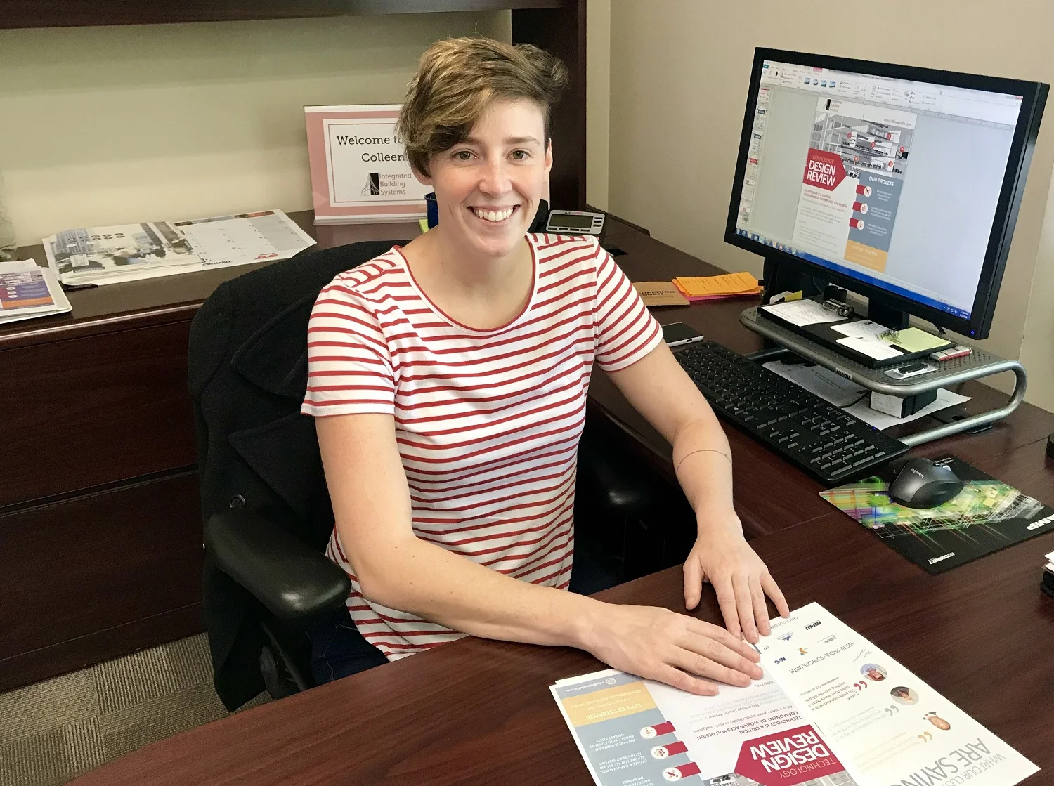Colleen McLain, wrapping up new marketing documents for Integrated Building Systems' Technology Design Review process and customer testimonials