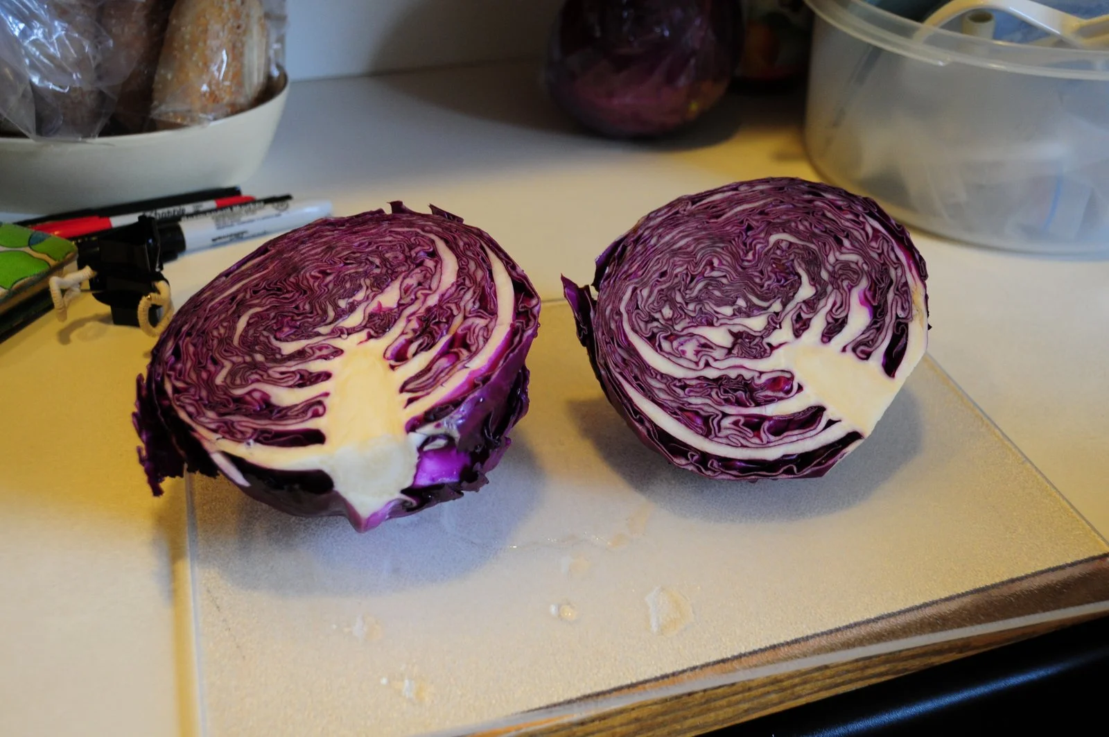 Red cabbage! In my opinion it makes better sauerkraut than green cabbage and turns out crispy and crunchy. Yum! You can cut it up into small strips yourself, use a mandolin, or use a food processor.