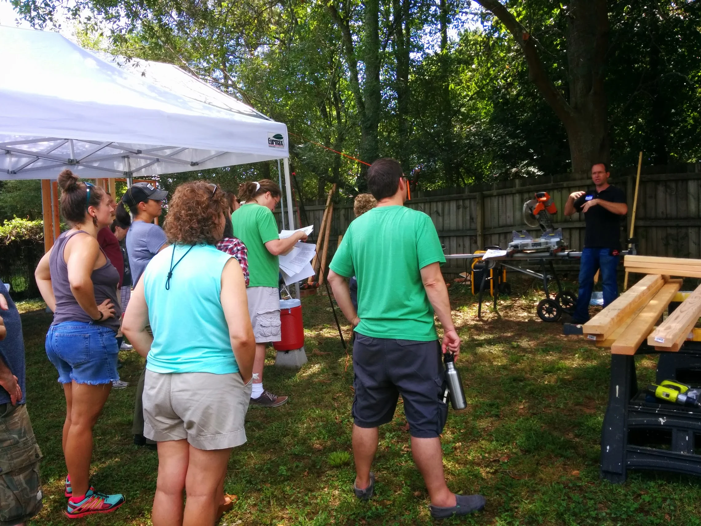 Dan explains how to use the chop saw before the students have a hand at it!