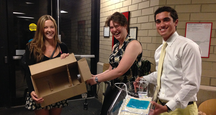 MIT Mechanical Engineers Cliodhna McCarthy, Kristen Zimmerman, and Eduardo Bacardi display their sketch models. Left: a mini incubator with hair dryer as heat source. Right: a resistive wire as found inside typical home heating pads.