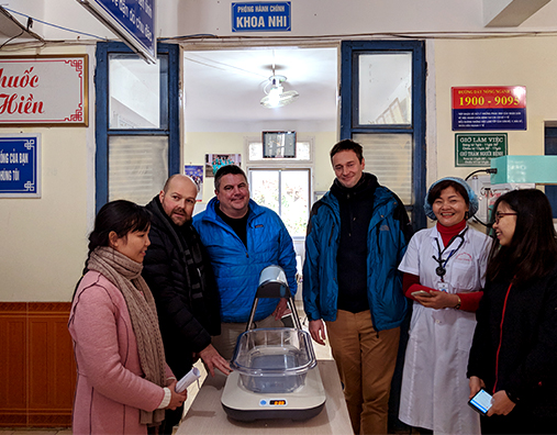 The Firefly team installing a new device at Thao Nguyen District Hospital in Moc Chau, Vietnam. From left, Hoi Nguyen and Luciano Moccia from Day One Health, Timothy Prestero from DtM, Greg Dajer from MTTS, Dr. Nguyen from Thao Nguyen Hospital and Hai Doan from MTTS.