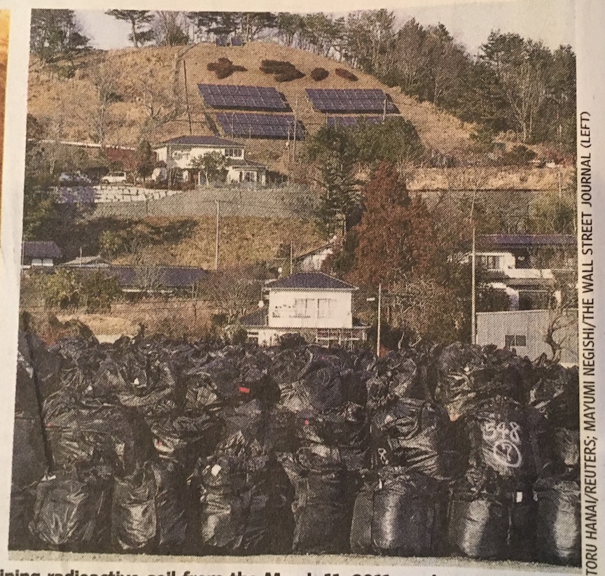Solar array behind bags of radioactive waste.jpeg