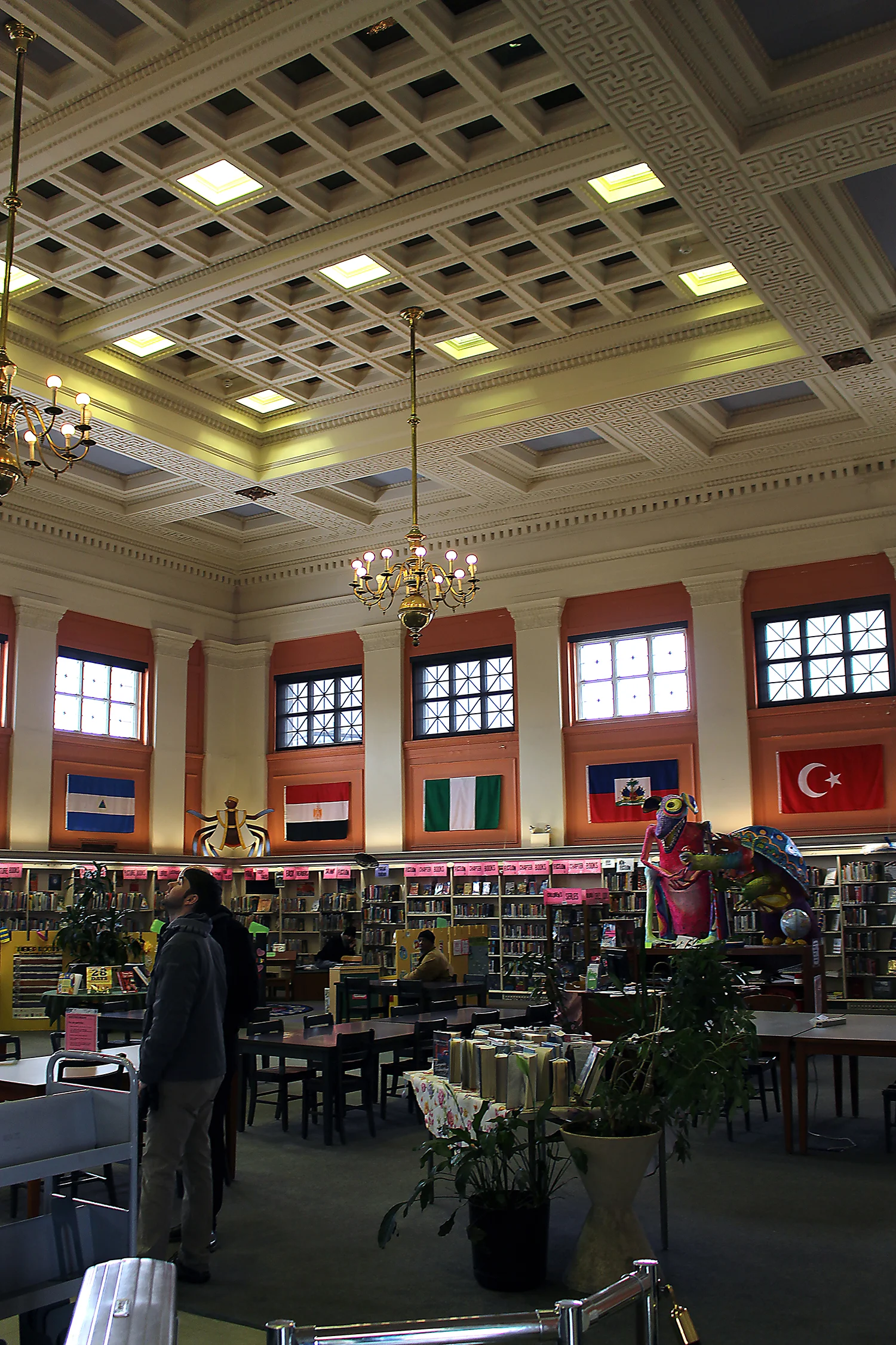 The main goal of the lighting was to introduce budget, energy and maintenance conscious lighting that provides even ambient light levels while respecting the character of the historic architecture. The greatest challenge was determining how to introduce adequate ambient light levels without compromising the integrity of the expansive 26-foot tall coffered ceiling. It was clear that during the 1960s, mercury vapor troffers were added to replace select sections of coffers.