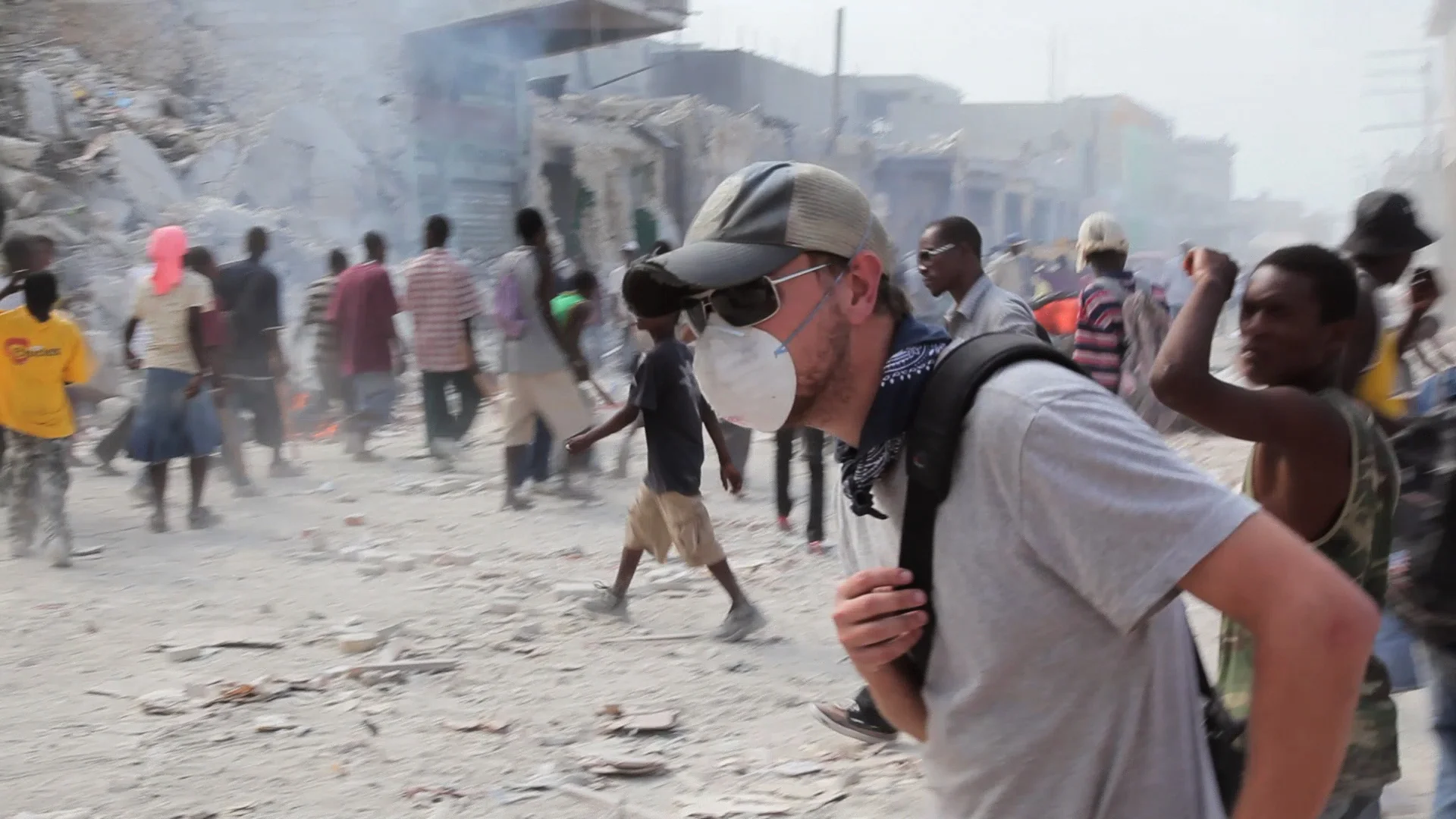 travel-the-road-haiti-earthquake-host-crowd-mask.jpg