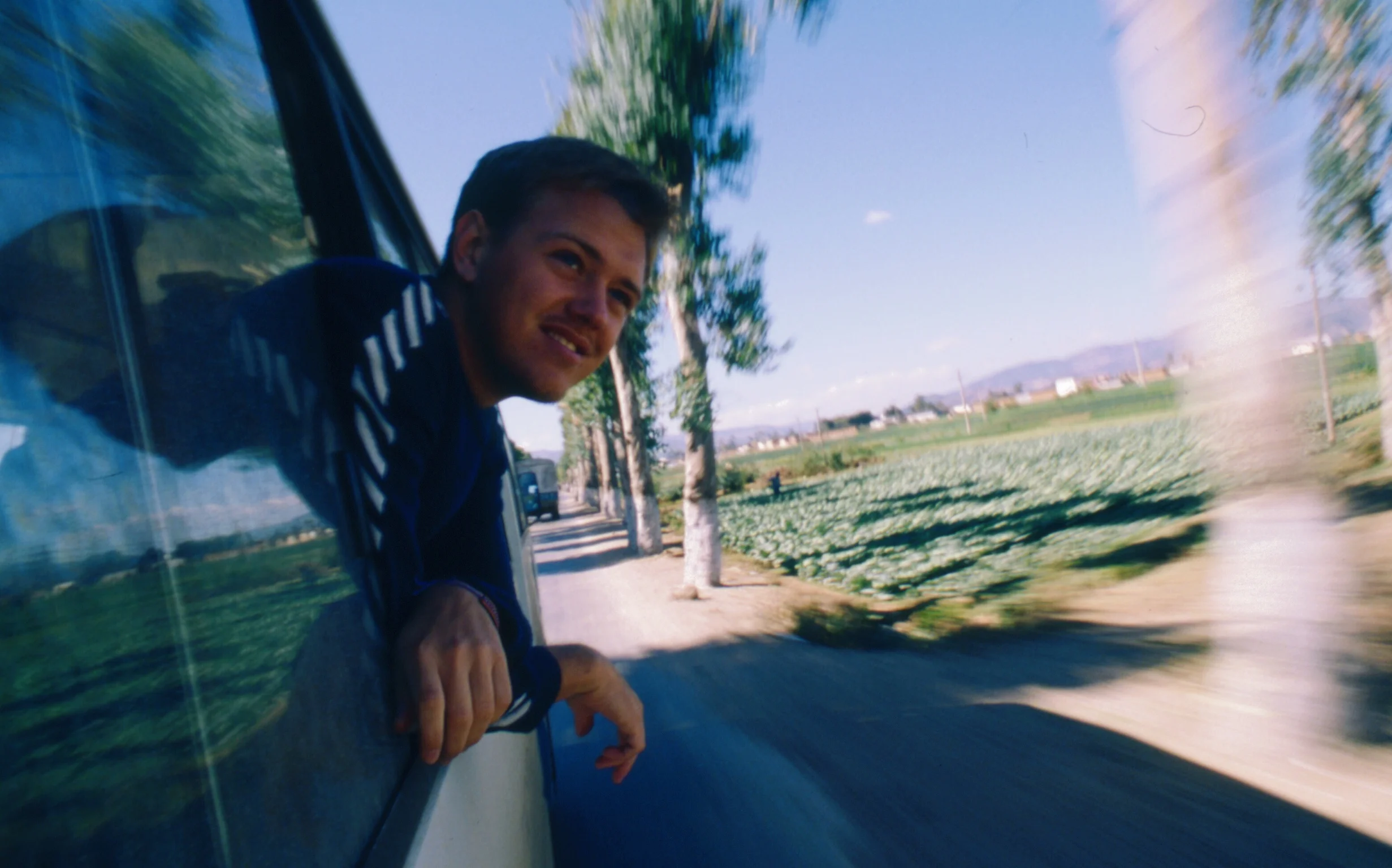 travel-the-road-road-trip-farmland-van-window.jpg