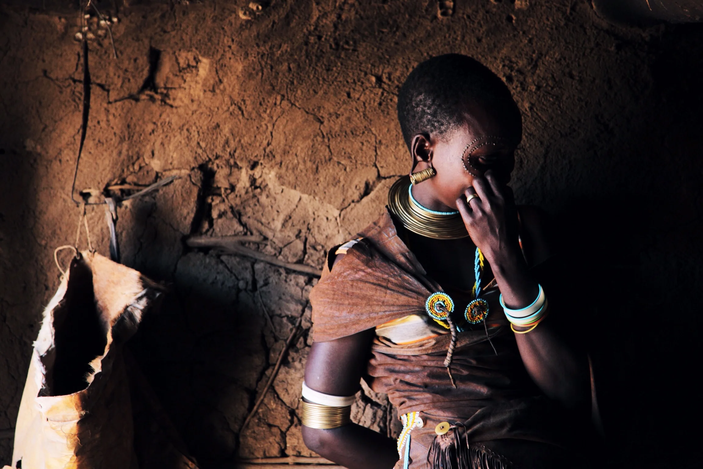 travel-the-road-east-africa-tribal-woman-portrait-hut.jpg