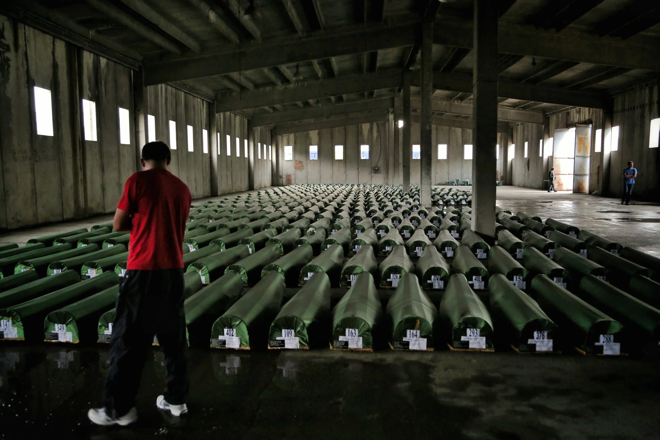 travel-the-road-bosnia-srebrenica-memorial-coffins.jpg