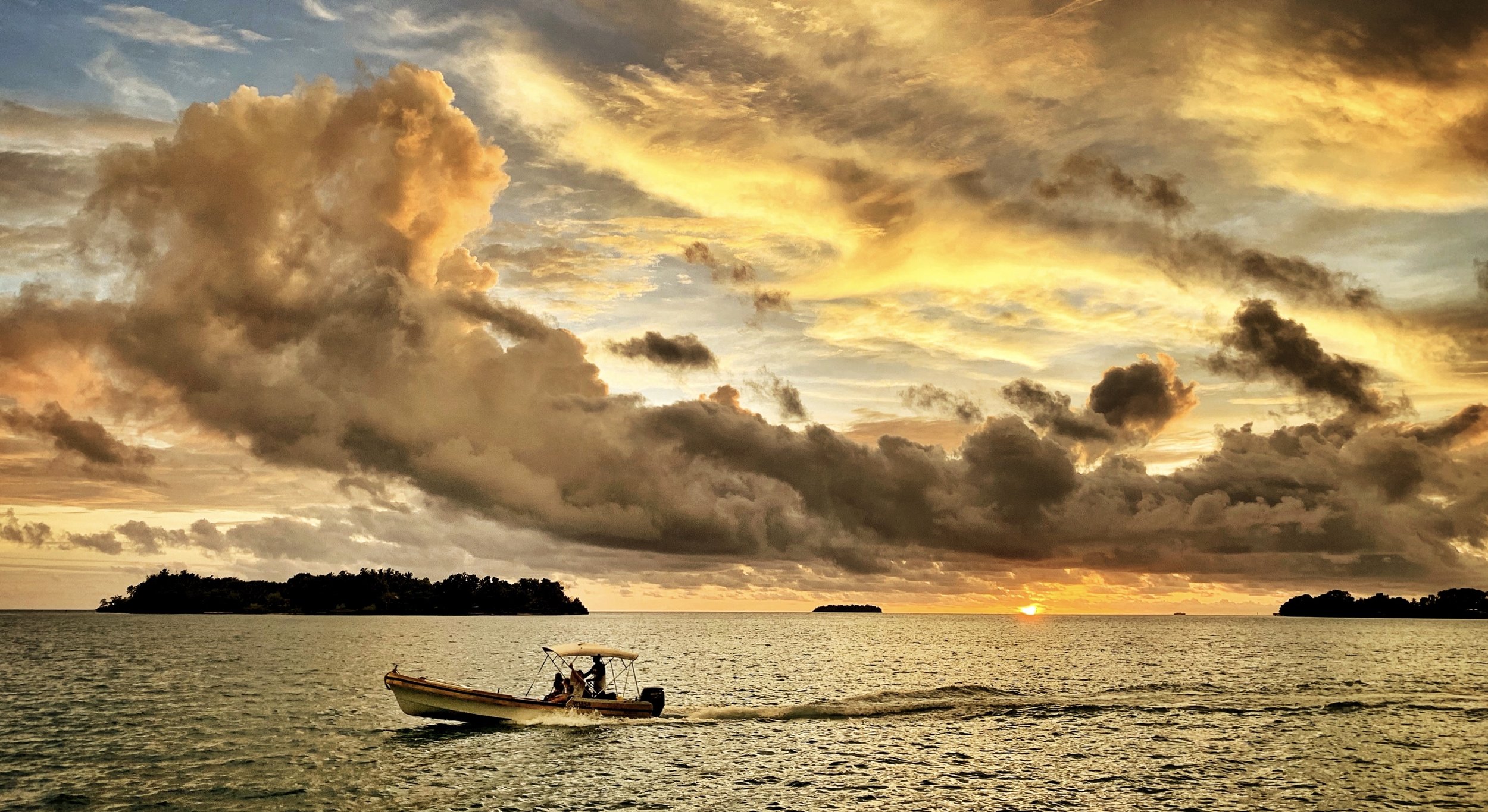 travel-the-road-solomon-islands-sunset-boat.jpg