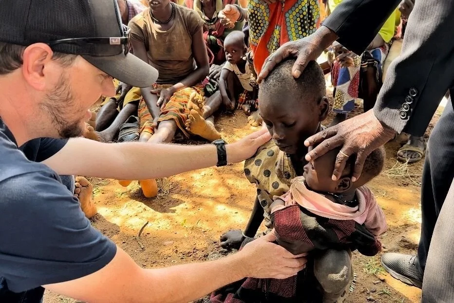 Praying for the sick &mdash; Karamoja, Uganda
