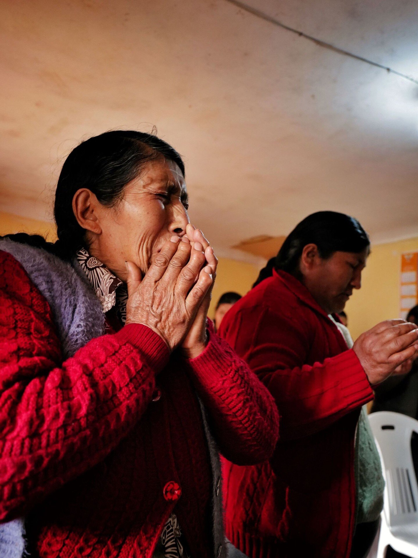 Prayer at a small church &mdash; Andes, Peru