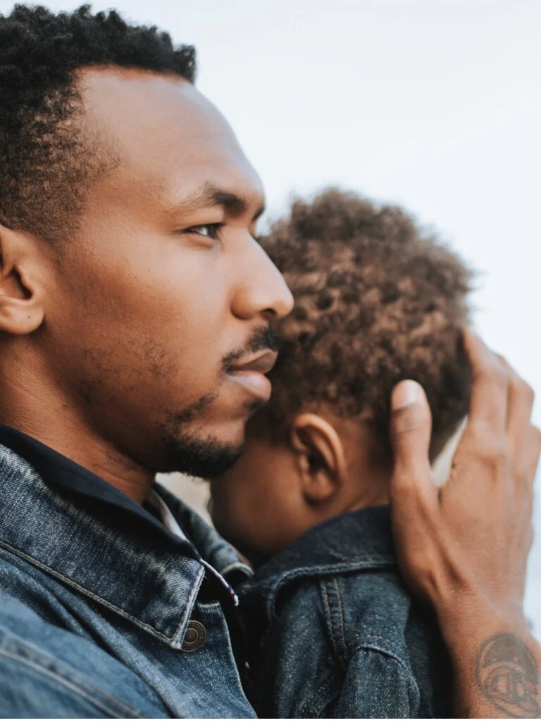 serious-dad-with-his-son-outdoors-picture-id1038578108.jpg