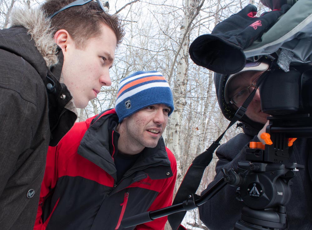 The three of us gather around the camera for playback.