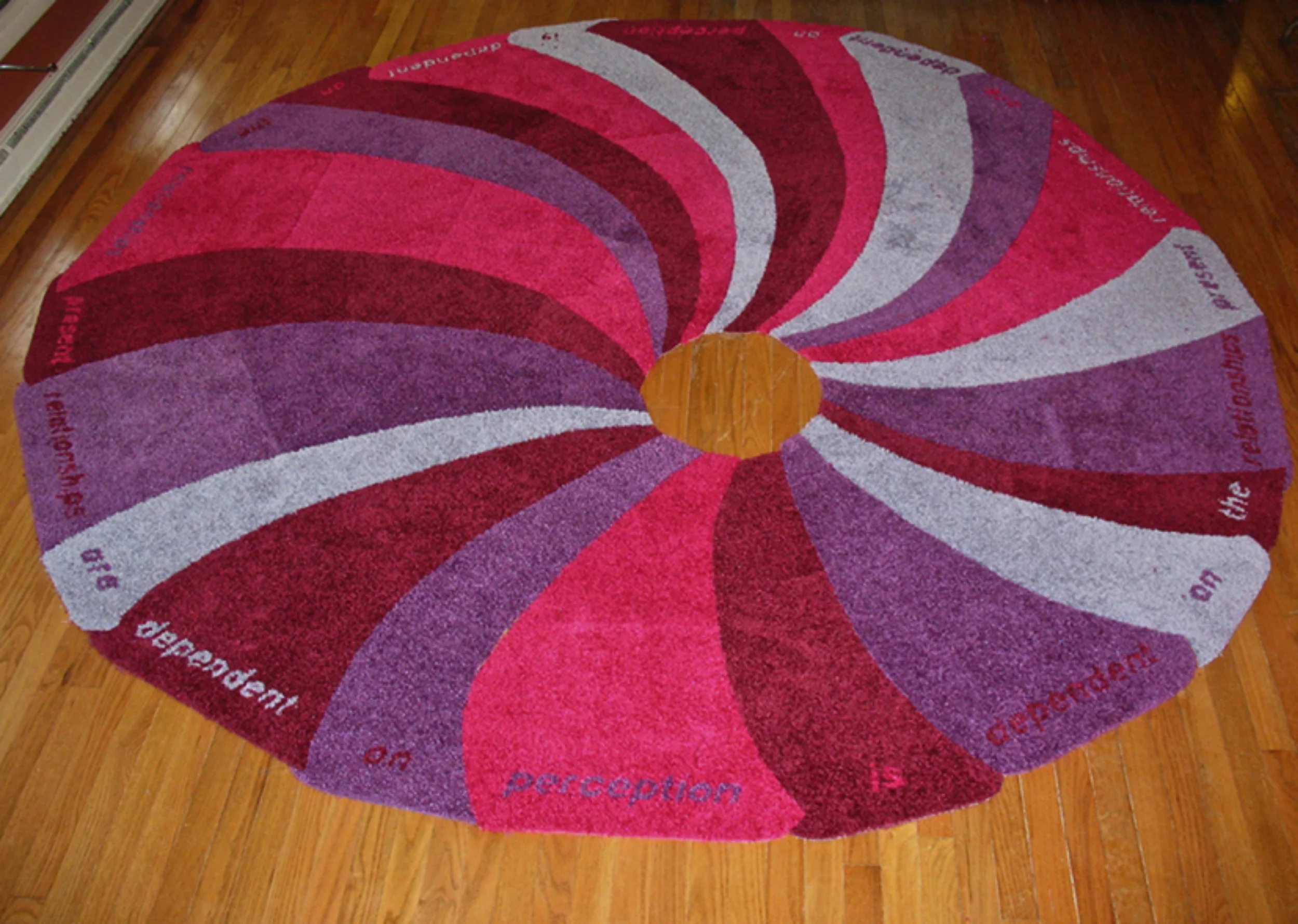 Image 19 Title: Forces of Nature: Whirlpools and Walmart Bath Rugs Year: 2008 Dimensions: 108 in x 116 in Media: Walmart clearance bath rugs and duct tape