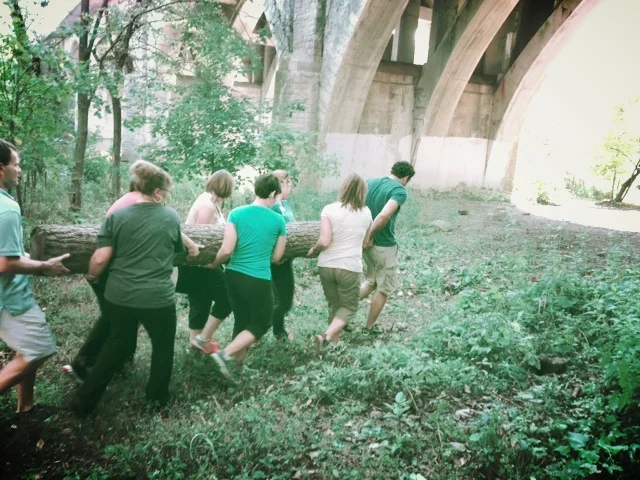 group carrying log.jpg