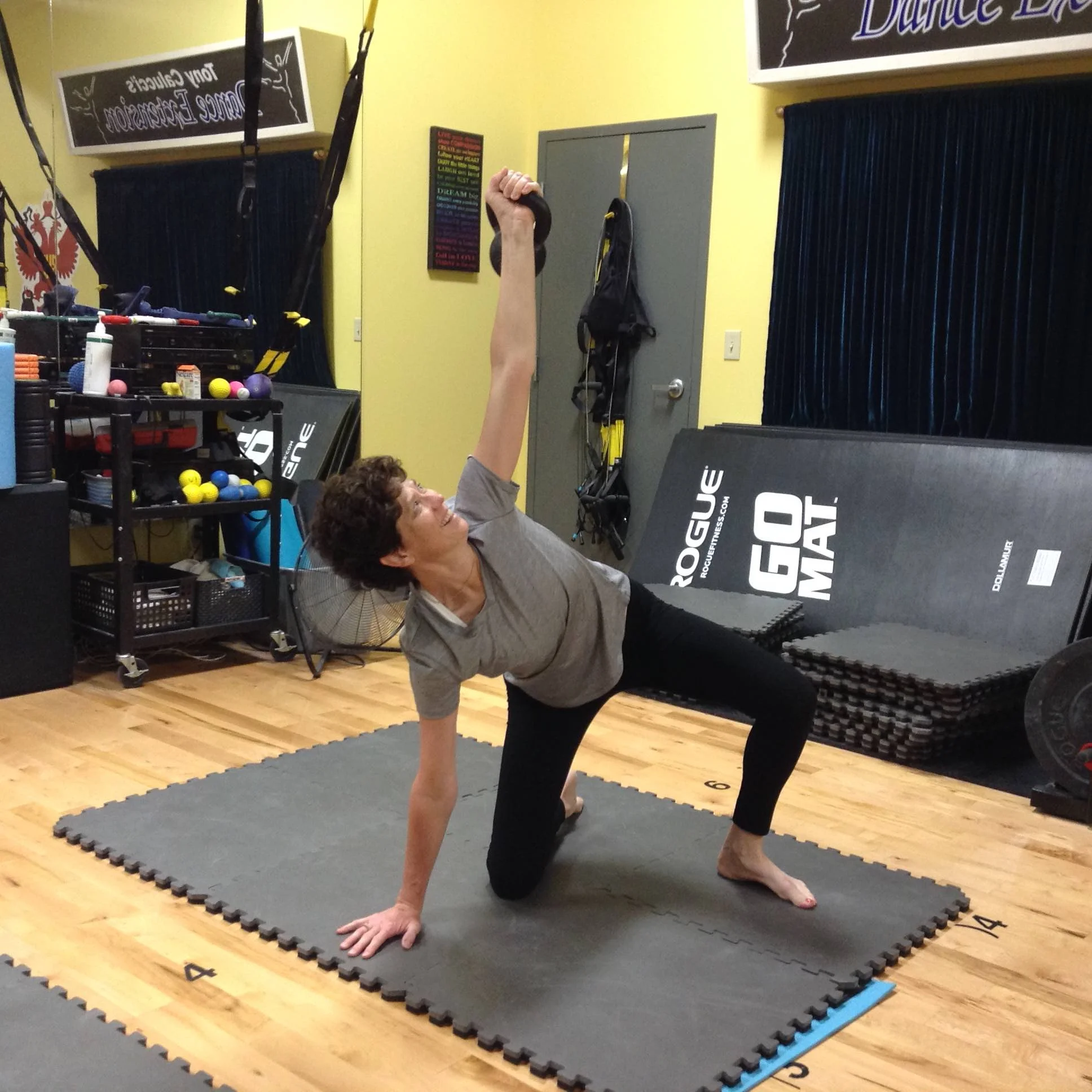Jennifer is new to us and is learning the 7-steps of the Turkish Getup. She is a professional organizer that places serious physical demands on her body. This training will help her get stronger and know how to move, lift and carry heavy boxes and other items on the job.