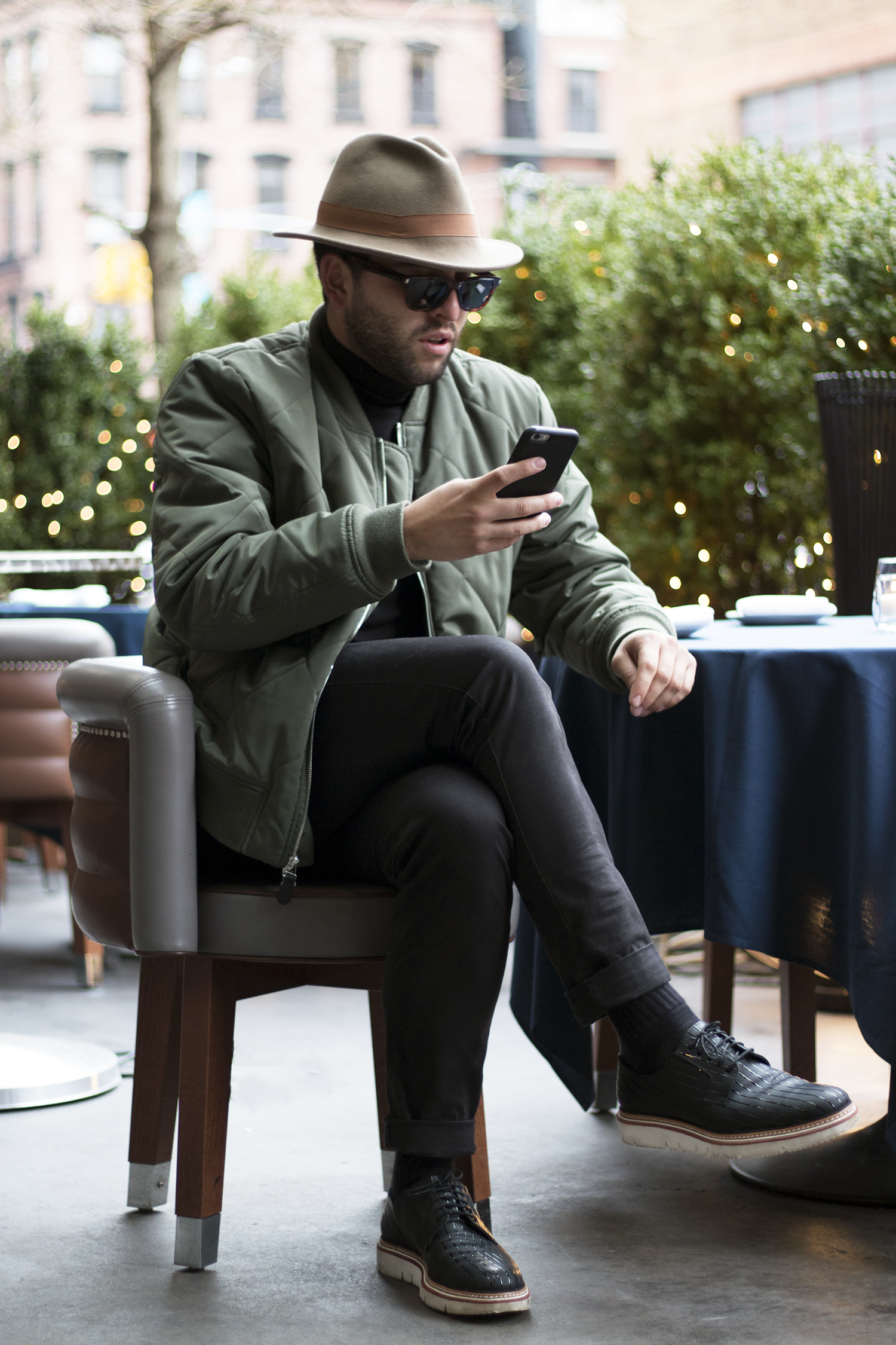 Pensively, awaiting the arrival of an Uber. Jacket: 7 For All Mankind/ Hat: Rag & Bone / Shoes: Jimmy Choo