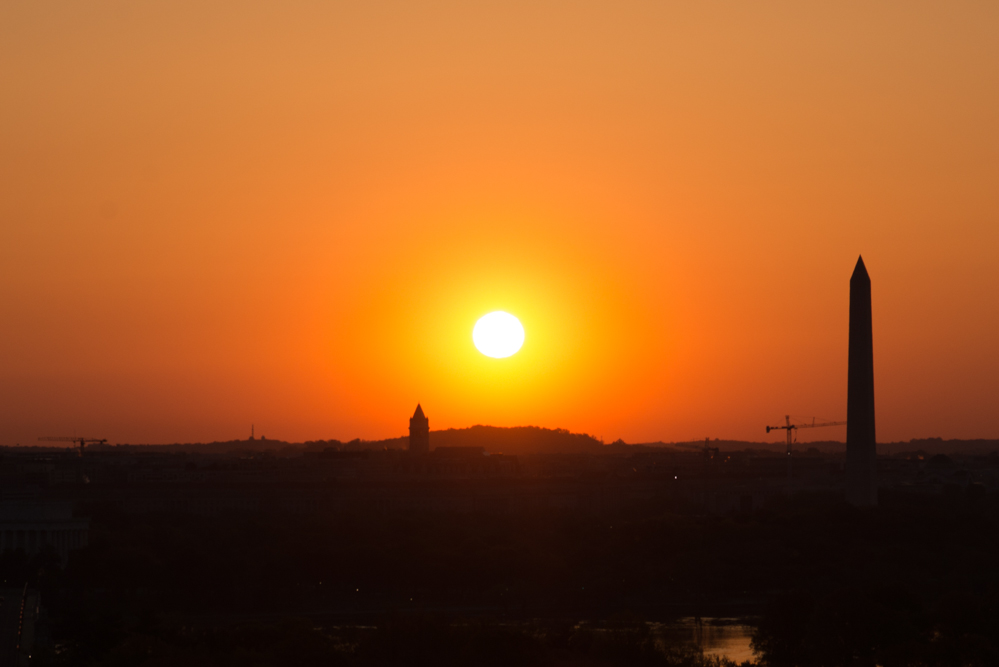 Tele-Zoom of the Sunrise with the Washington Monument as a Silhouette