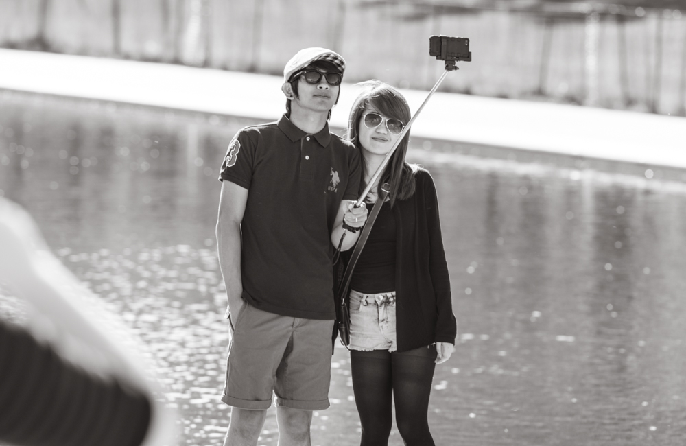 As odd as it may look, it keeps you from asking strangers to take your picture just to find out that they were able to bend the laws of physics by having everything in front of you and behind you in focus, while you look like an out-of-focus blob