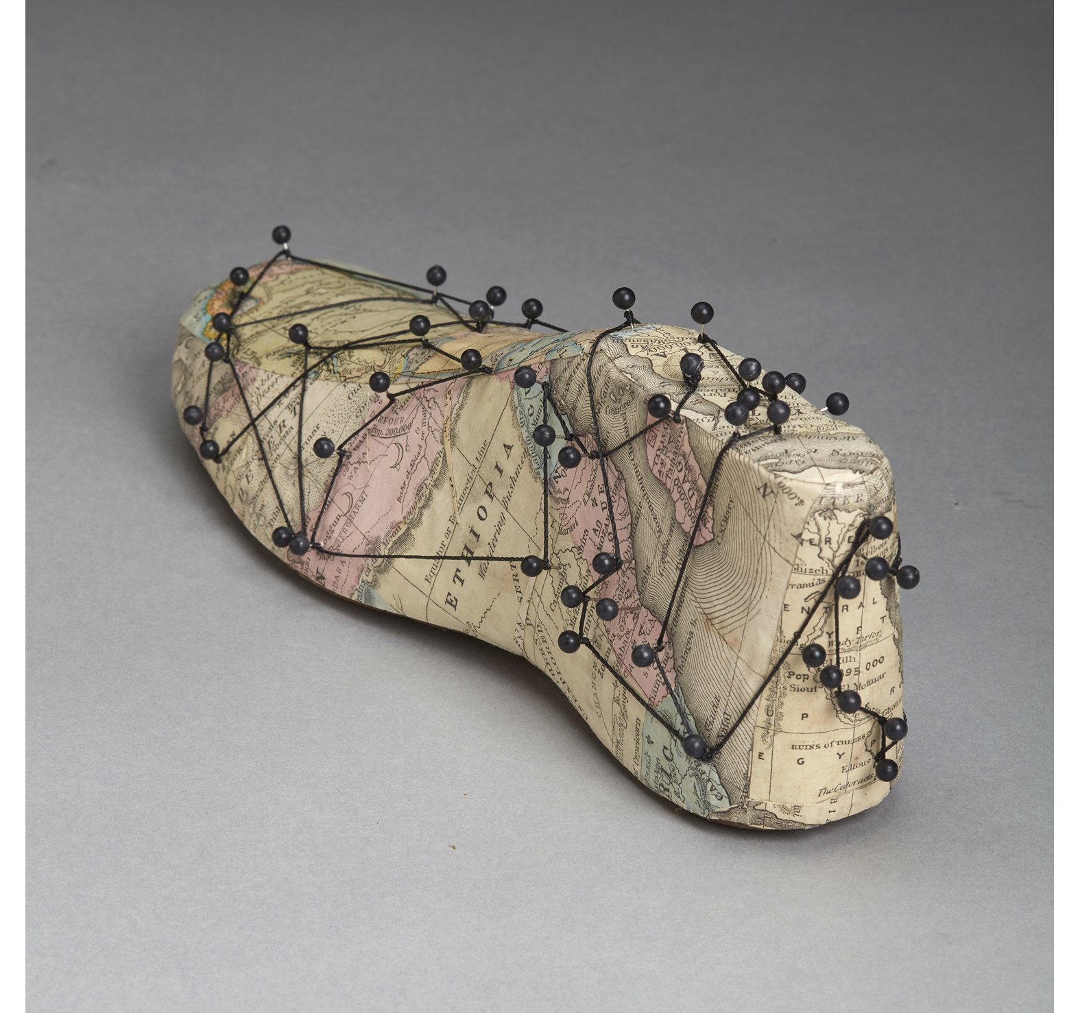 61. Kunstadt_Migration_antique wooden shoe form, map pins, paper- 19th C. maps, 3 x 3.25 x 9.5 in, 2023.jpg