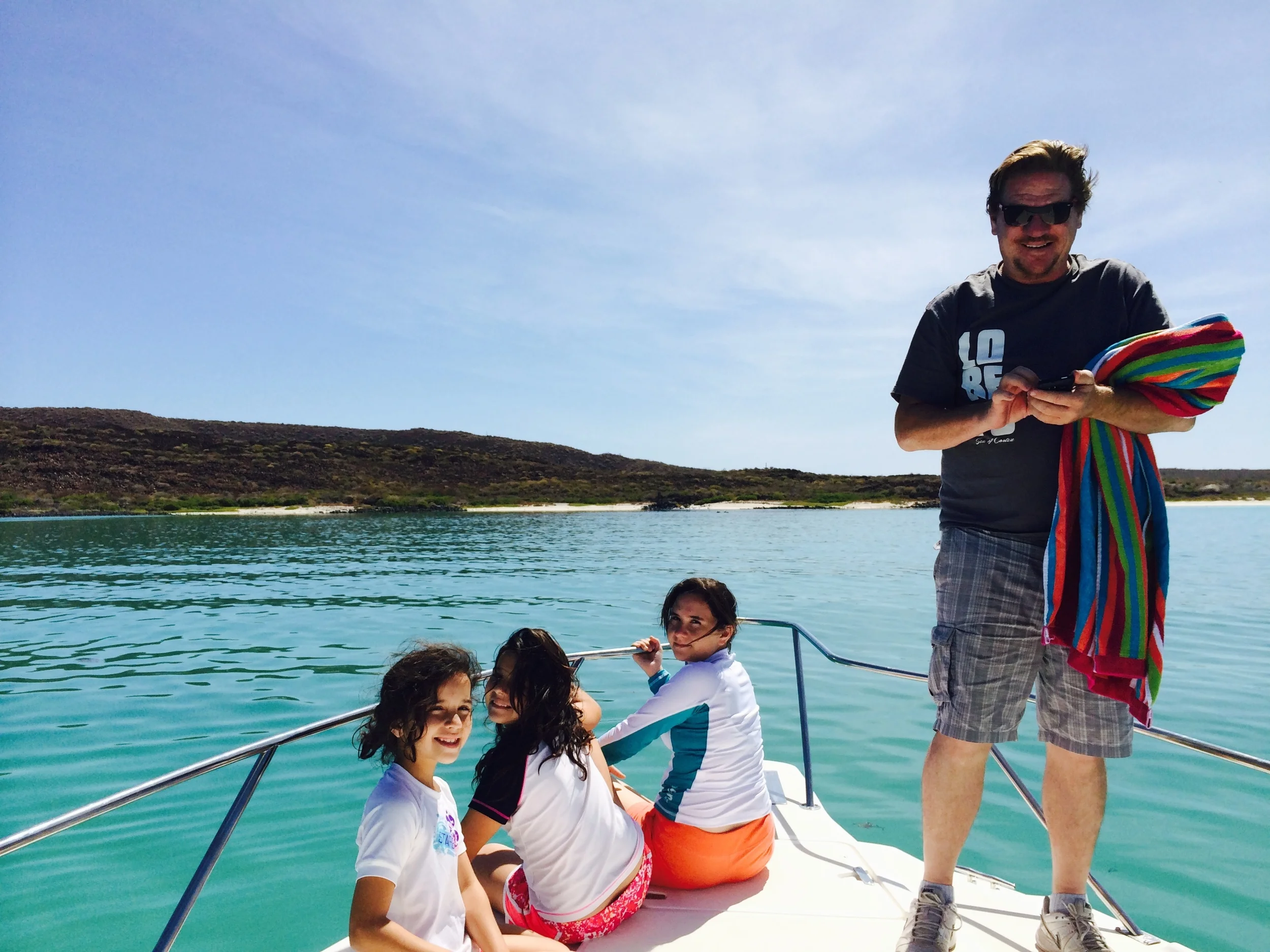 Jeff Gill and his daughters enjoying the sunshine and turquoise blue water just off Coronado Island