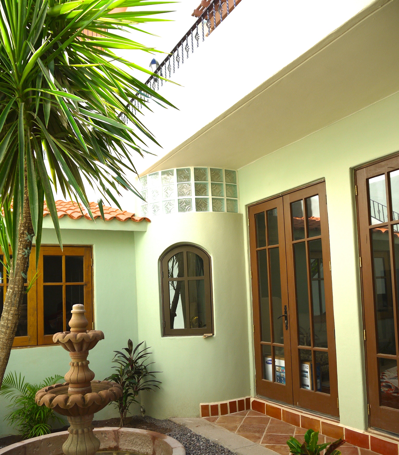 Private garden courtyard, doors leading to main floor interior