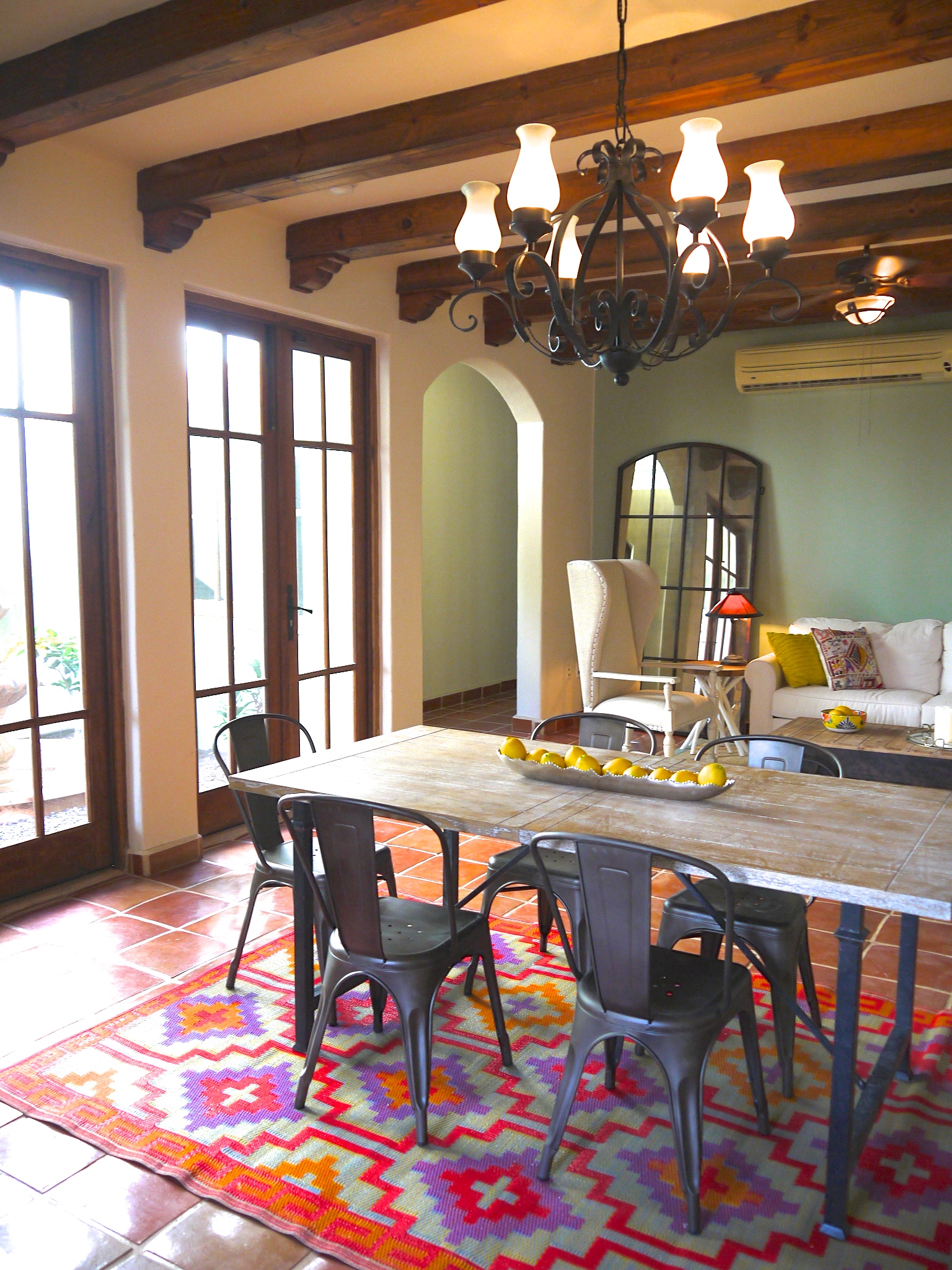 Dining table, doors leading out to private fountain courtyard