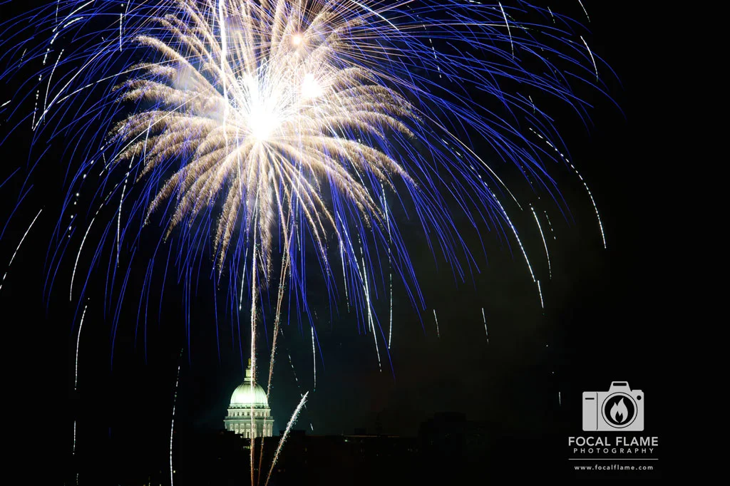 Pyrotechnical effects of every hue illuminated the Madison, WI sky and reflected off Lake Monona. (c) 2014 Focal Flame Photography | Photo credit: Clint Thayer