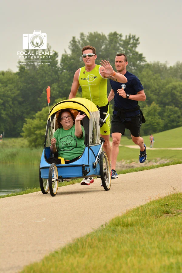 A bike trailer converts to a running cart, helping the Care2Tri team achieve their goal. The Chicago chapter raised funds for the Wike cart for use in training and competition. © 2014 Focal Flame Photography | Photo credit; Jacob Ennis
