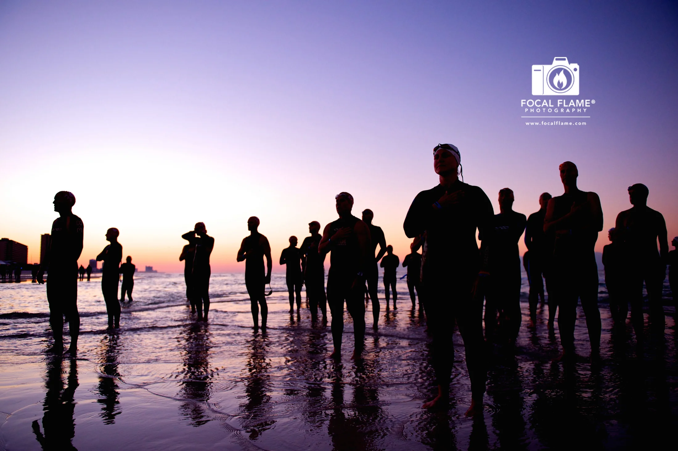 "Waiting" by Clint Thayer depicts a serene moment prior to a triathlon start. 
