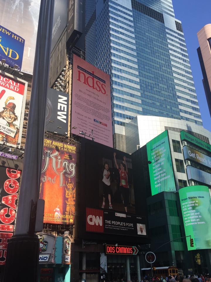 The National Down Syndrome Society seeks to raise awareness of the amazing accomplishments of individuals with Down syndrome through their Time Square video presentation. The image of Abbey running the Twilight 10K was one of 450 chosen to promote the value, acceptance and inclusion of people with Down syndrome.