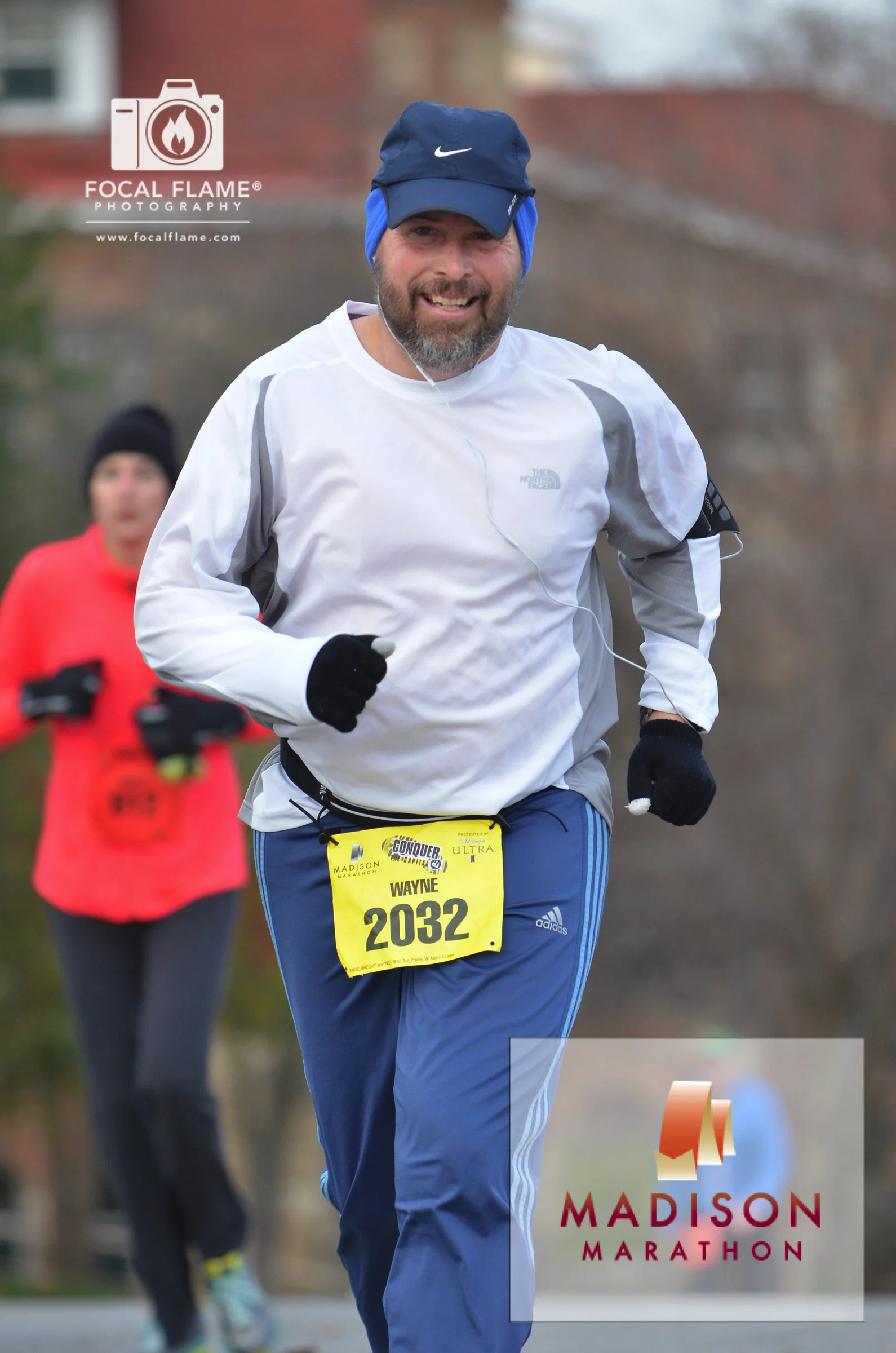 Wayne Enbelbrecht runs the 2014 Madison Fall Marathon. He has volunteered to help support the race for the past 10 years. © 2014 Focal Flame Photography | Photo credit: Austin Cope