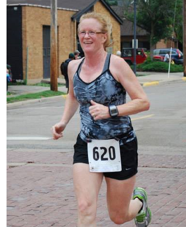 Carolyn looks forward to competing in her first-ever Madison Marathon on November 8, running as a guide alongside her running partner. Photo credit: Adam Kissinger