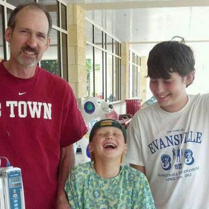 James Helmuth with father (Jeff) and older brother (Jack). Photo courtesy of Lisa Helmuth.