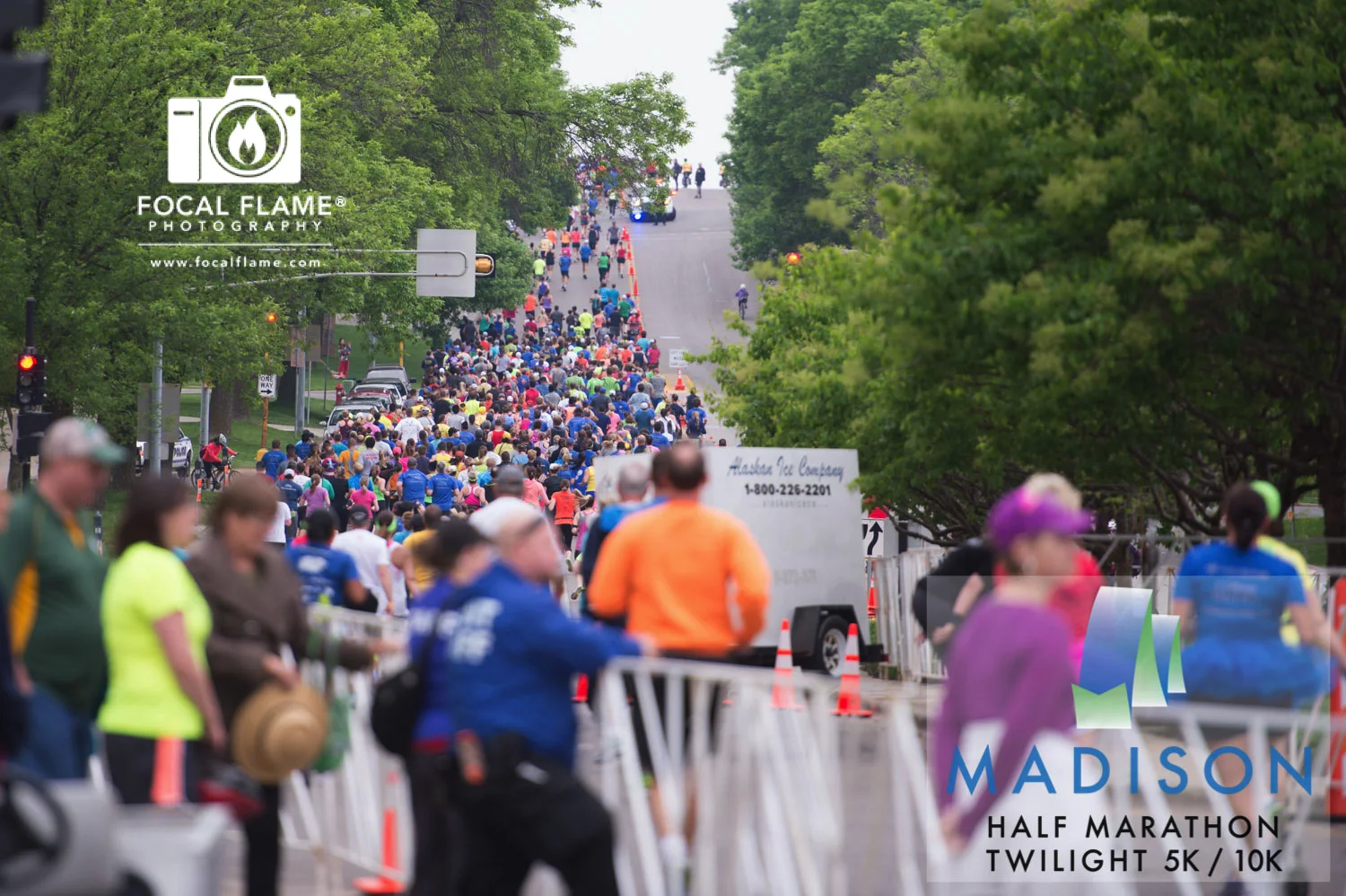 Race planning starts months in advance, with organizers doing everything from obtaining permits and keeping registration running smoothly to organizing hundreds of volunteers to setting up barricades, orange cones, and course markings. Photo (c) 2015 Focal Flame Photography | Credit: Austin Cope