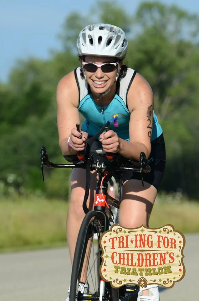 Triathlete Debra Vaughan calls this photo "happy bike." (c) 2015 Focal Flame Photography | Photo credit: Will Hughes.