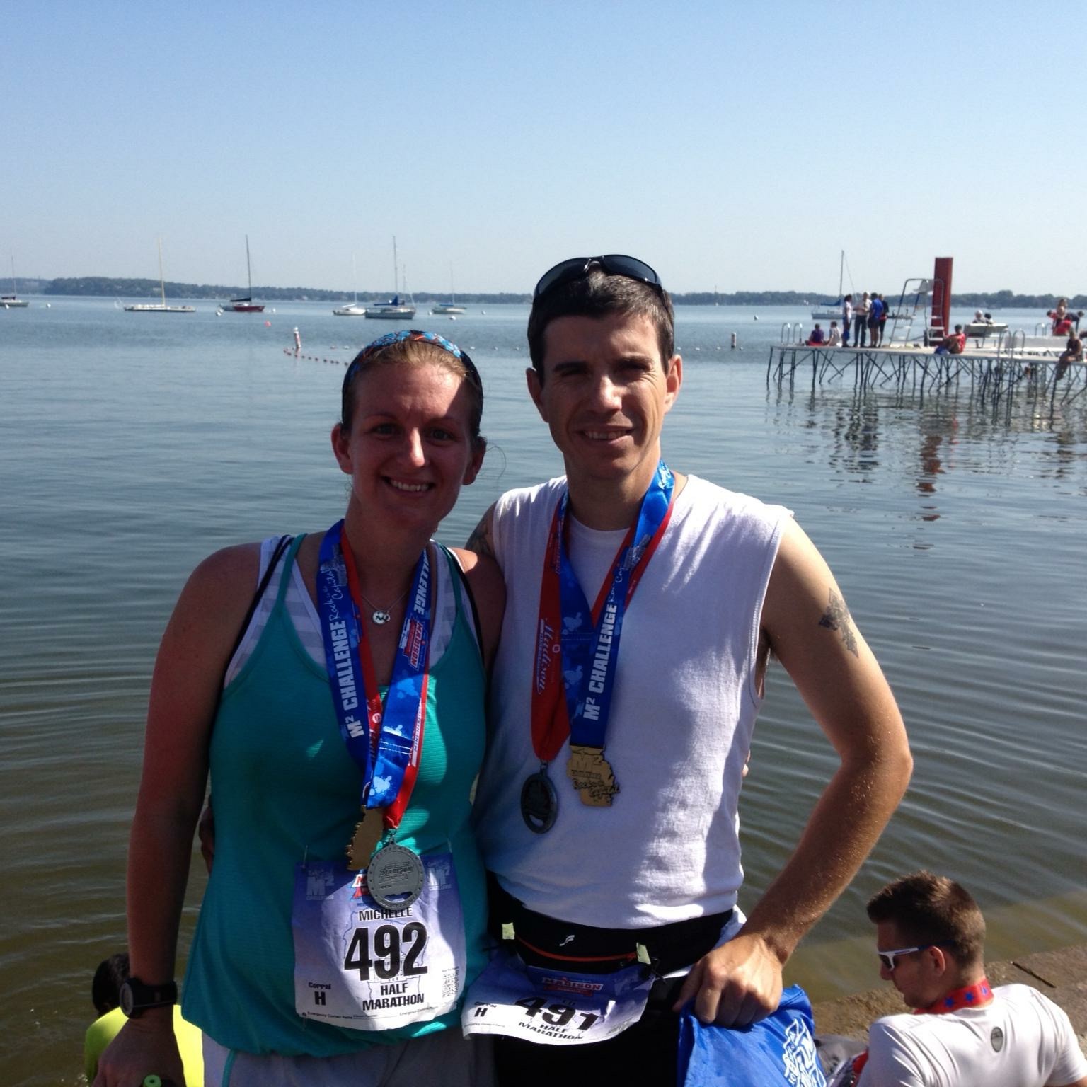 Michelle and Ed show off their medals after a race in Madison in 2013. Photo courtesy of Michelle Poelsterl.