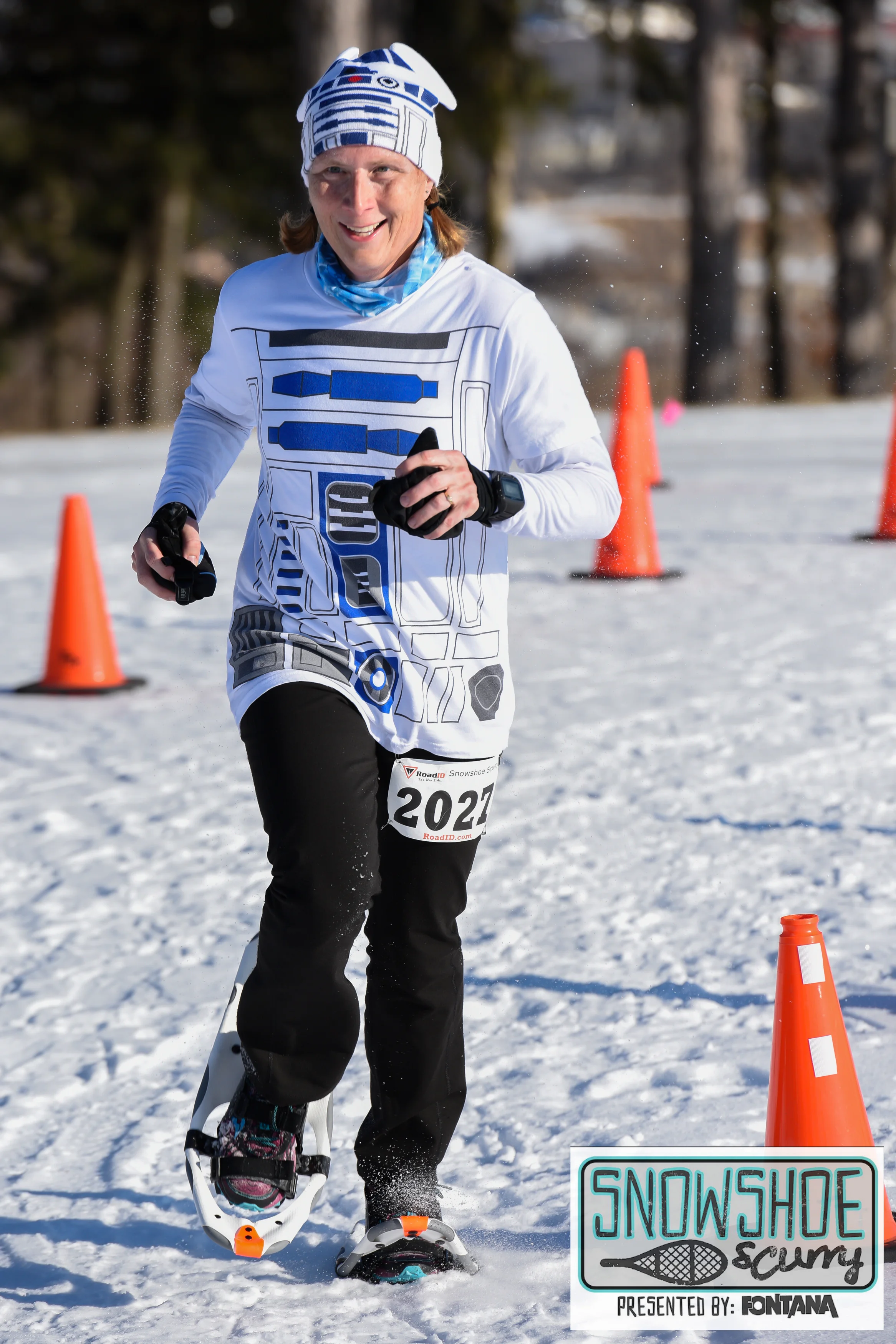 Glenda runs through the winter on snowshoes. (c) 2016 Focal Flame Photography | Photo credit Brent Stepanik.