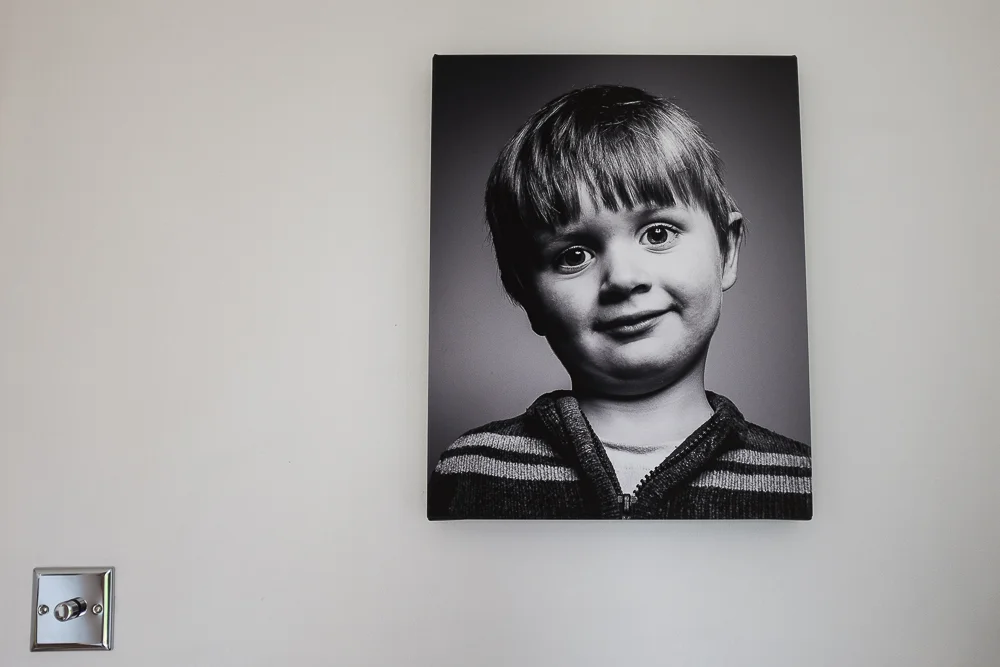 The size of this one is 16" x 20". It's big enough for this wall and for this particular photo, but would probably look a little small on a big wall or with an environmental portrait showing other details.