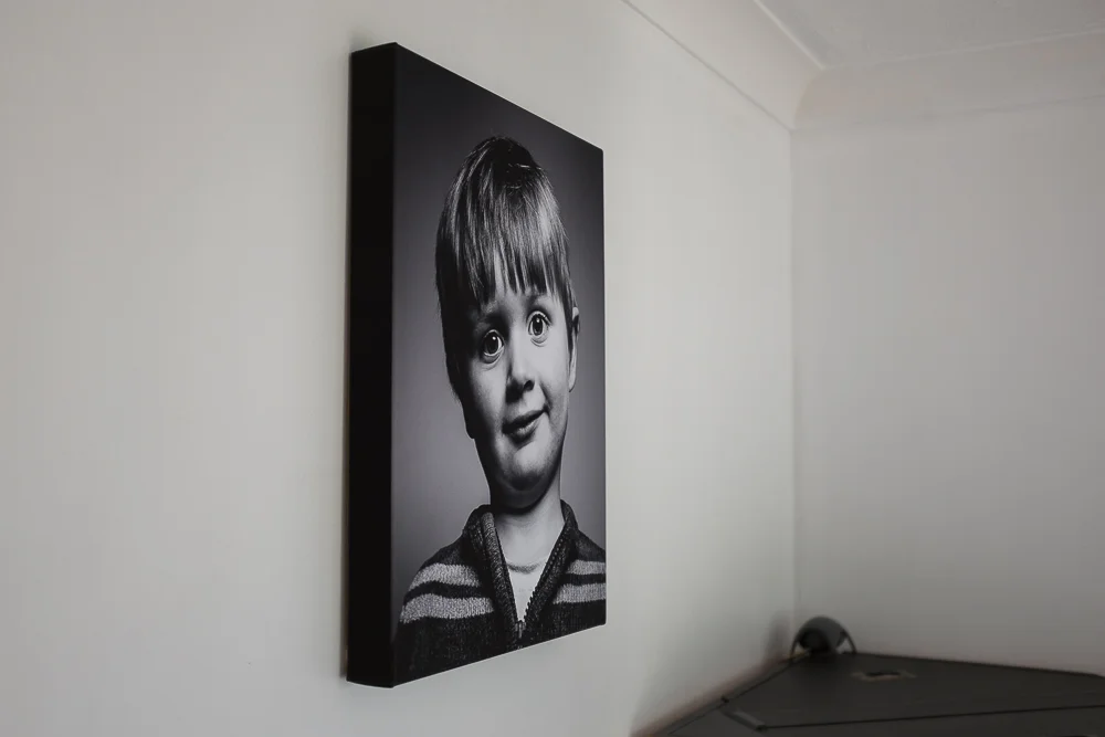 I chose to have the black edging on this canvas because it would have cropped the photo too much to have the image wrap around the canvas frame. The frame hangs flush with the wall and came with all fixtures attached ready for hanging.