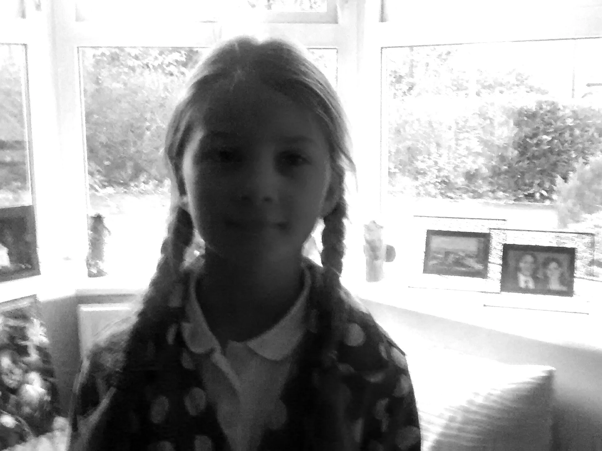 The light from the window behind Jorja is so bright that her face is in shadow