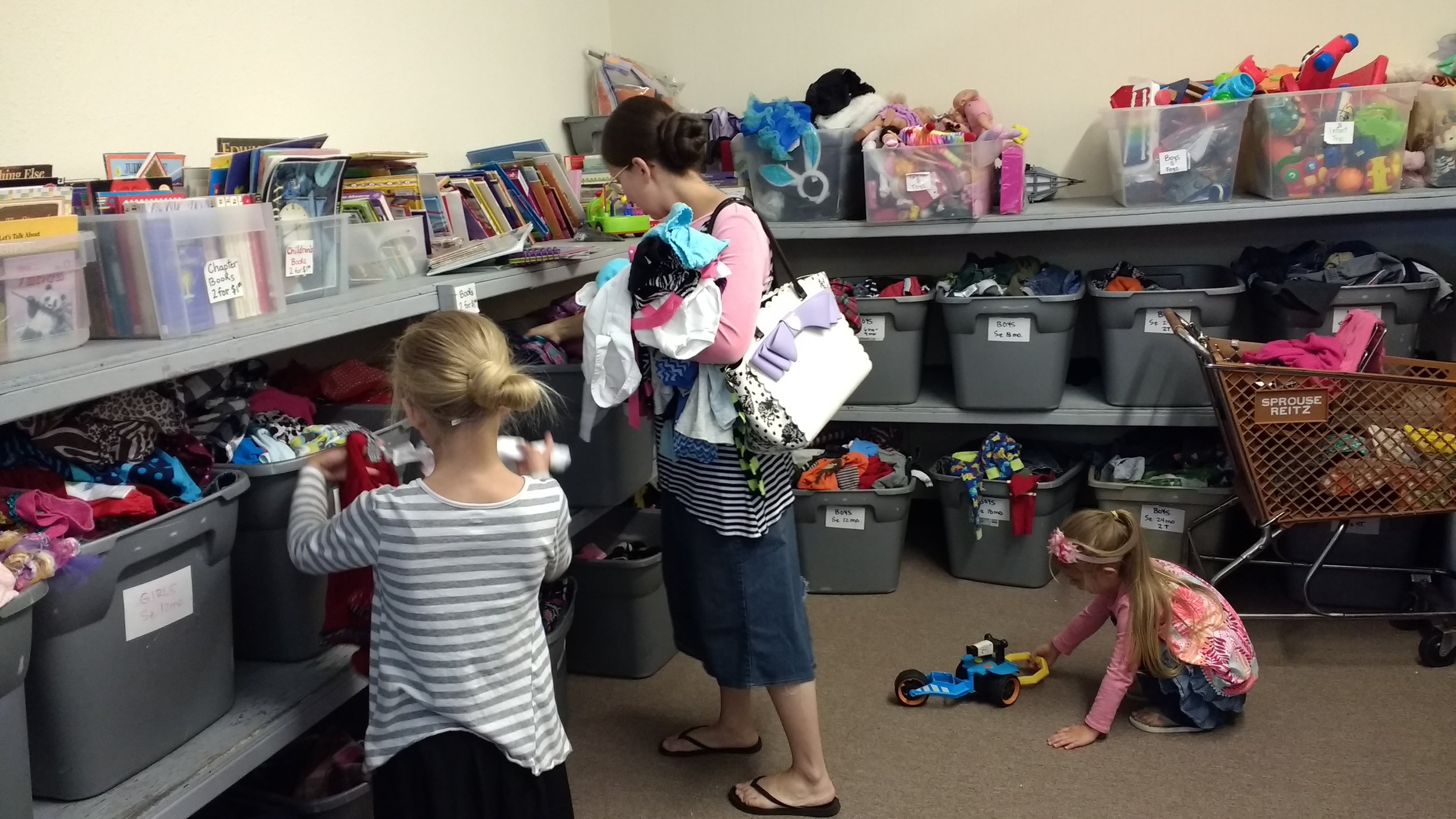 Sis. Jennifer, Mandy and Megan finding good deals in the "Dollar Room" at That Baby Store