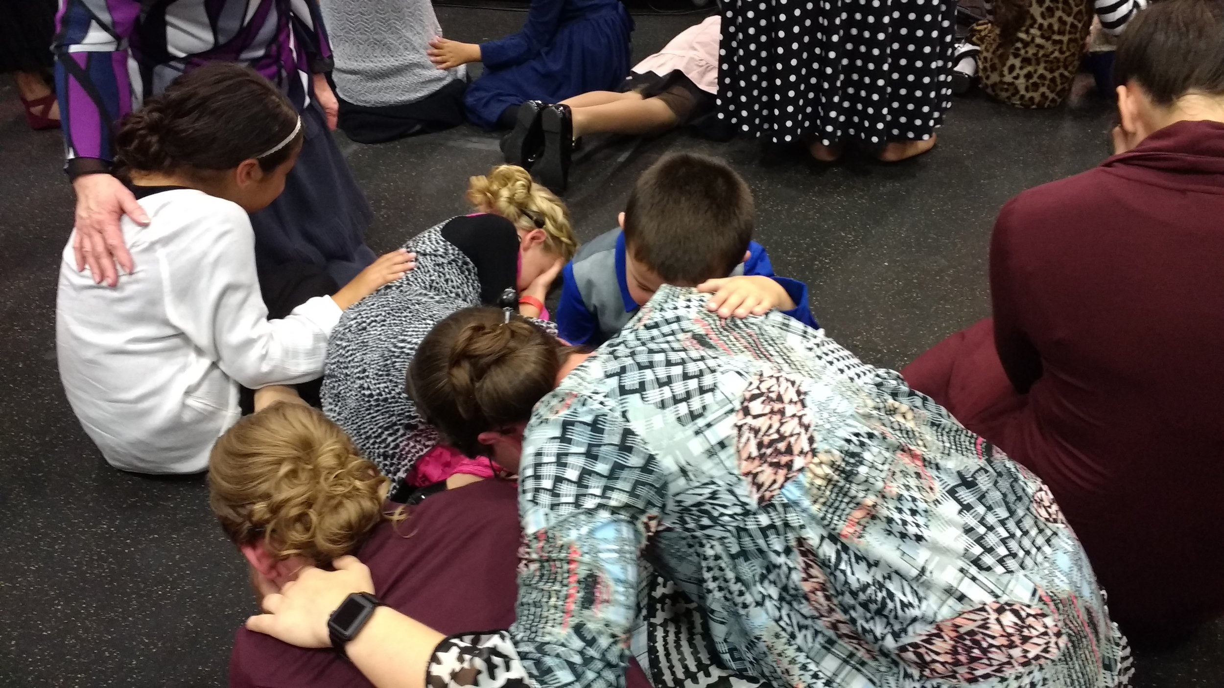 Sis. Jennifer, Chloe and little Jared praying for his Mommy