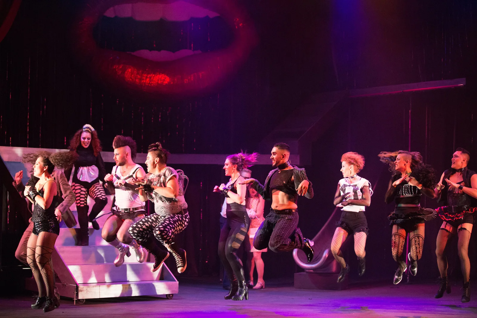 margaret_whitaker_Rocky_Horror_Show_Tiime_Warp_Ensemble_mid_jump.jpg