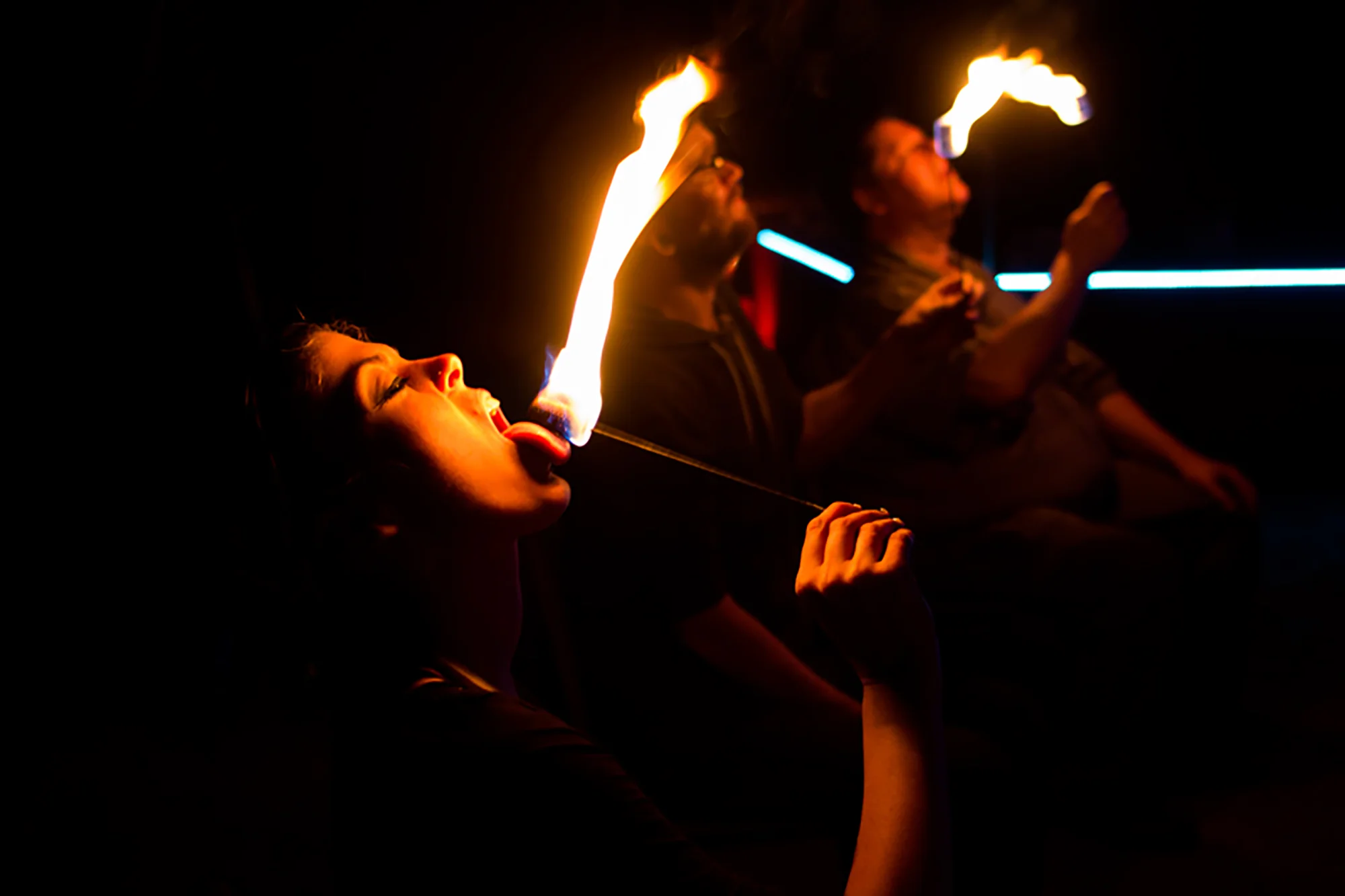 Student, Julia Phelps, left, at the Circus Farm's Dragon Training Workshop with Crystal Cruz on Jan. 25 in Mesa, AZ, practiced fire eating. 